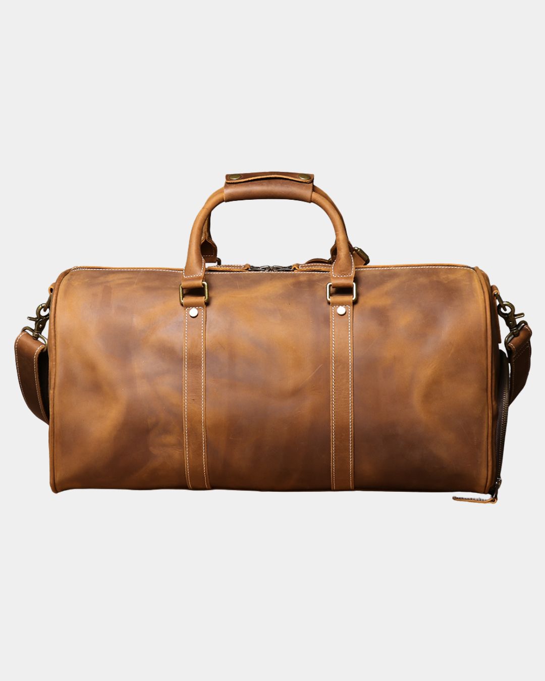 Back view Men's brown crazy horse leather duffel bag with luggage tag and crossbody strap by Hudson & Tate.