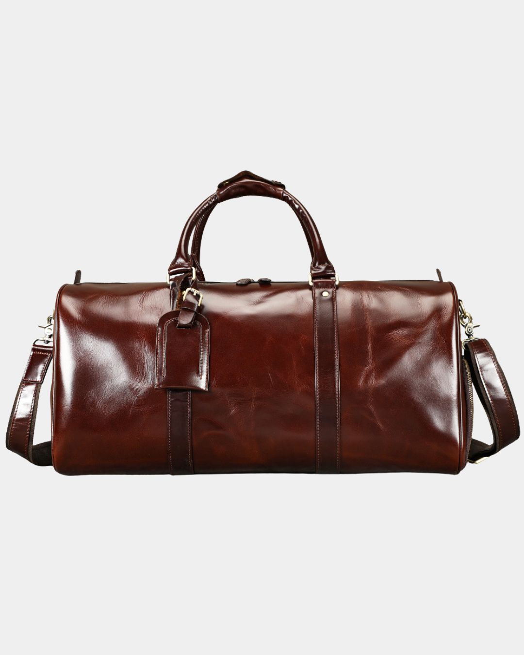 Detail of men's leather weekender duffel bag luggage tag and zip closure