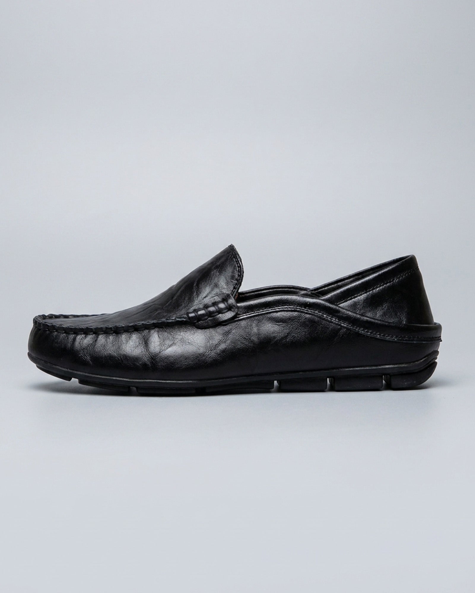 Side view of Beckett men's black leather driving loafer