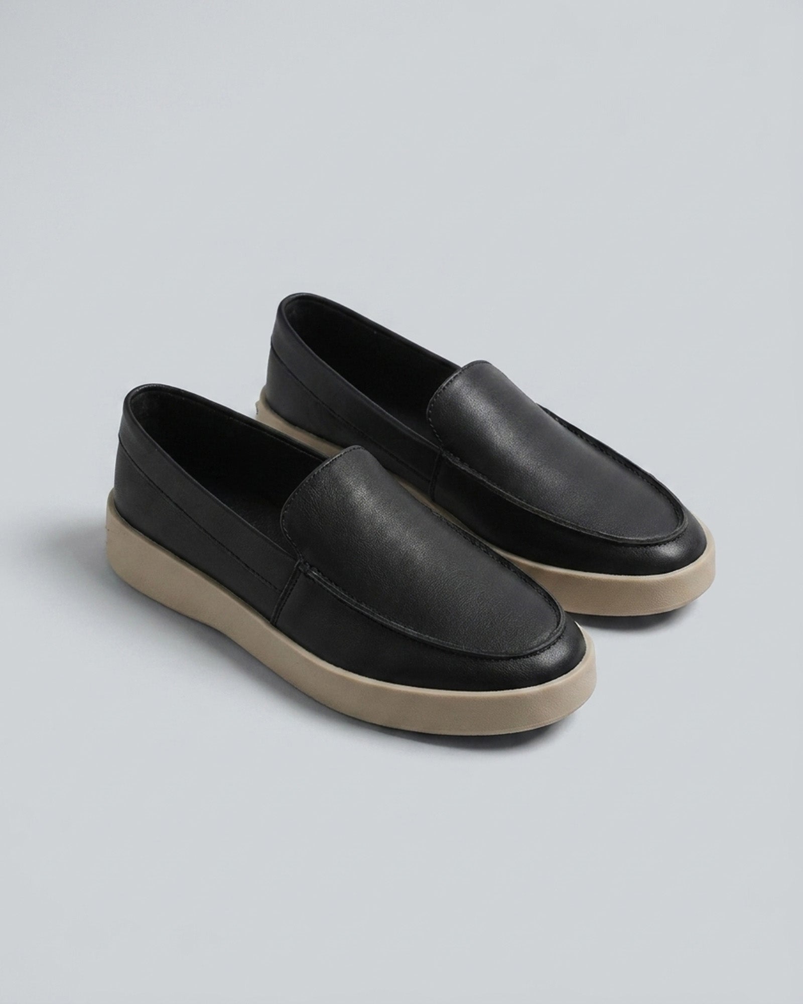 Pair of Boston men's black slip-on loafers with chunky cream sole