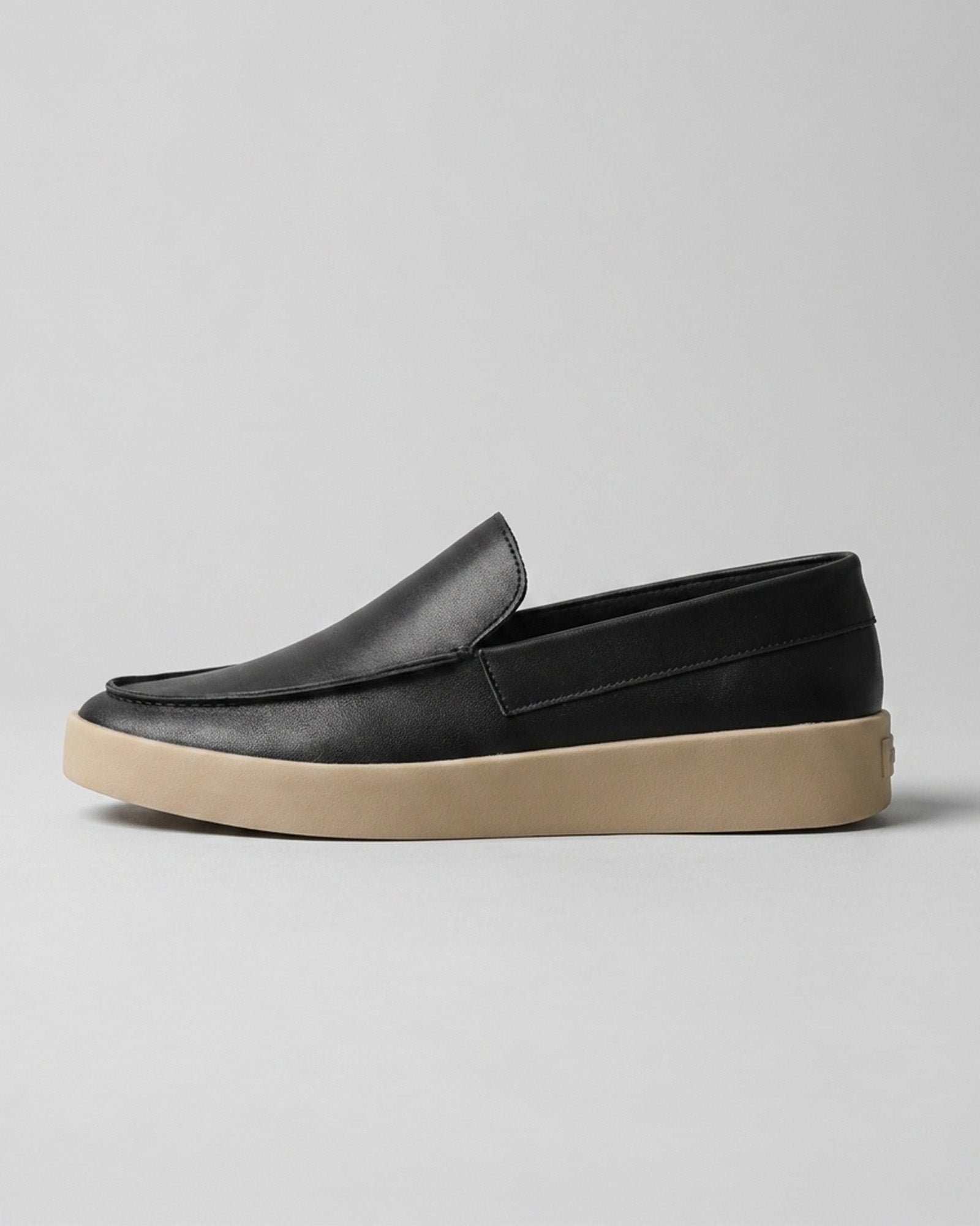 Side view of Boston men's black slip-on loafer with cream outsole
