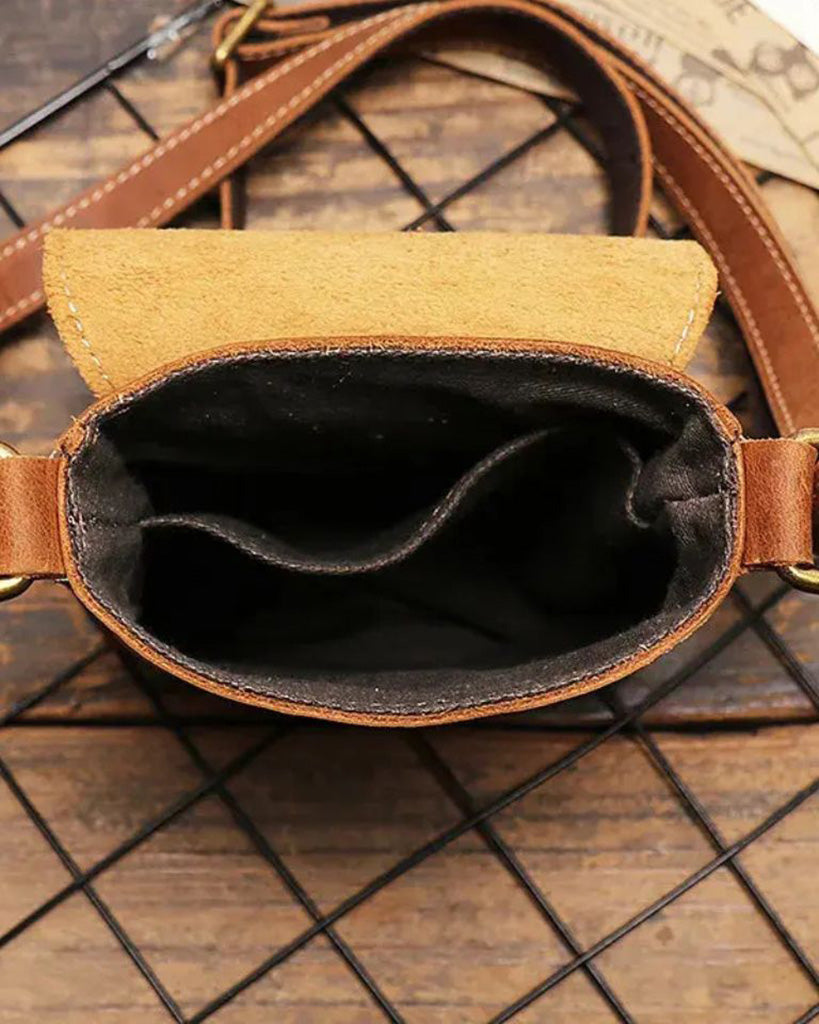 Interior view of Brescia men's brown genuine leather phone bag showing main compartment and genuine leather lining