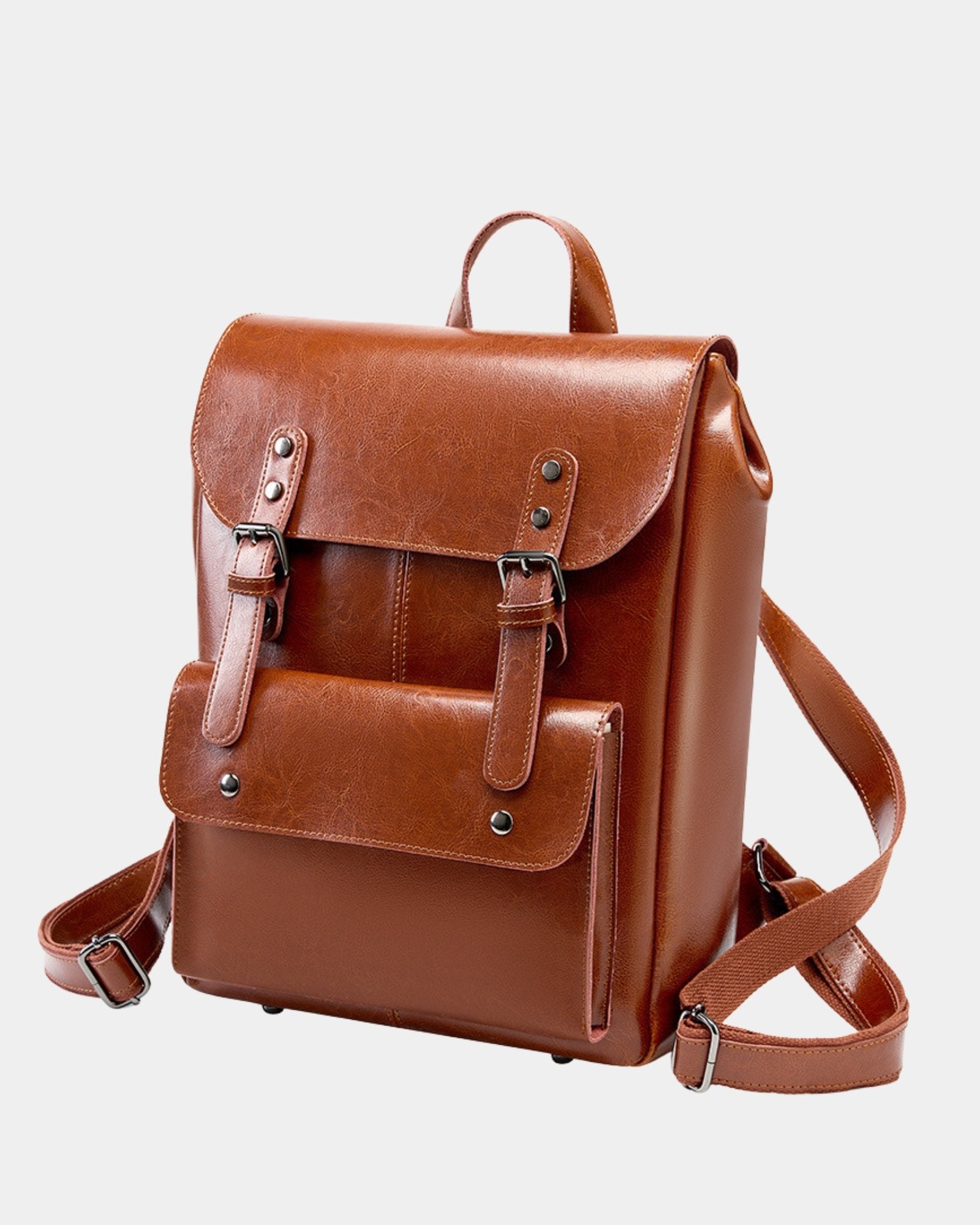 Three-quarter view of Cambridge brown leather backpack showing structured silhouette and adjustable straps