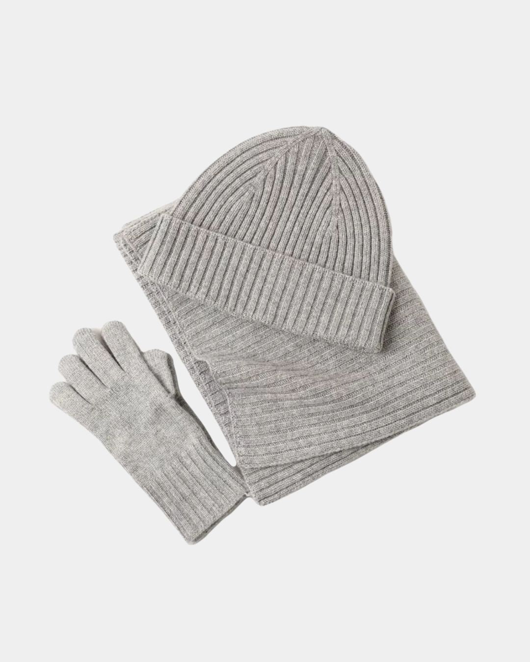 Light grey cashmere winter set featuring a ribbed knit beanie, long scarf, and matching gloves.