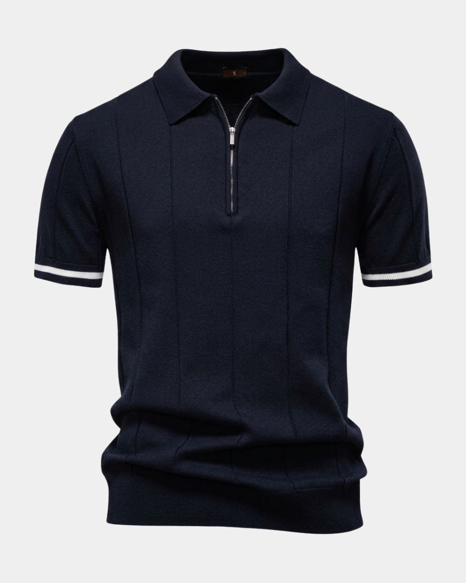 Navy blue polo shirt with white trim on a light gray background