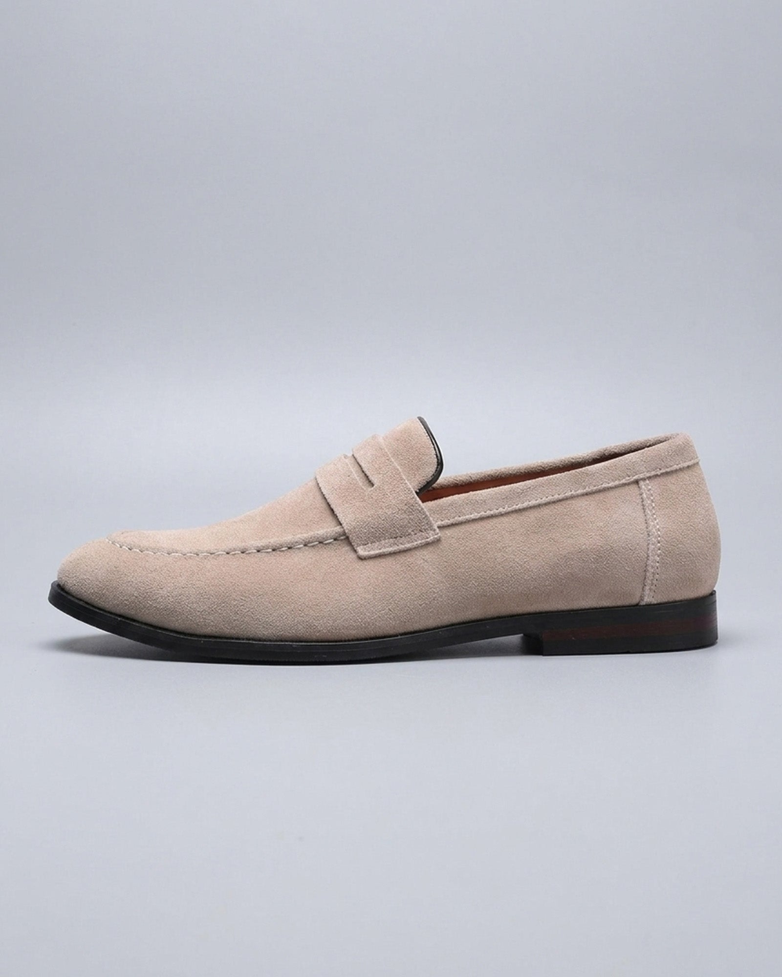 Side view of Harper men's beige suede penny loafer on grey background