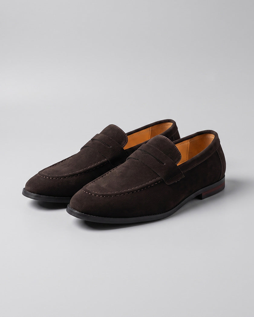 Pair of Harper men's dark brown suede penny loafers with red sole detail