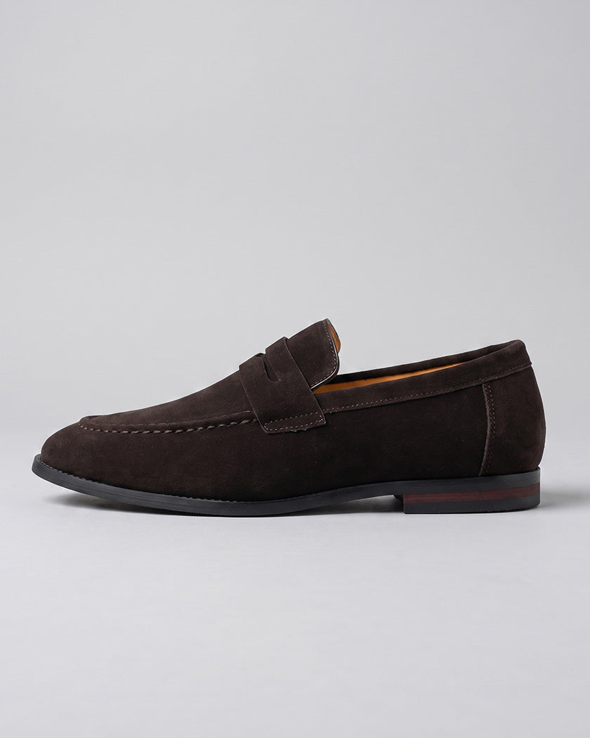 Side view of Harper men's dark brown suede penny loafer with red sole detail