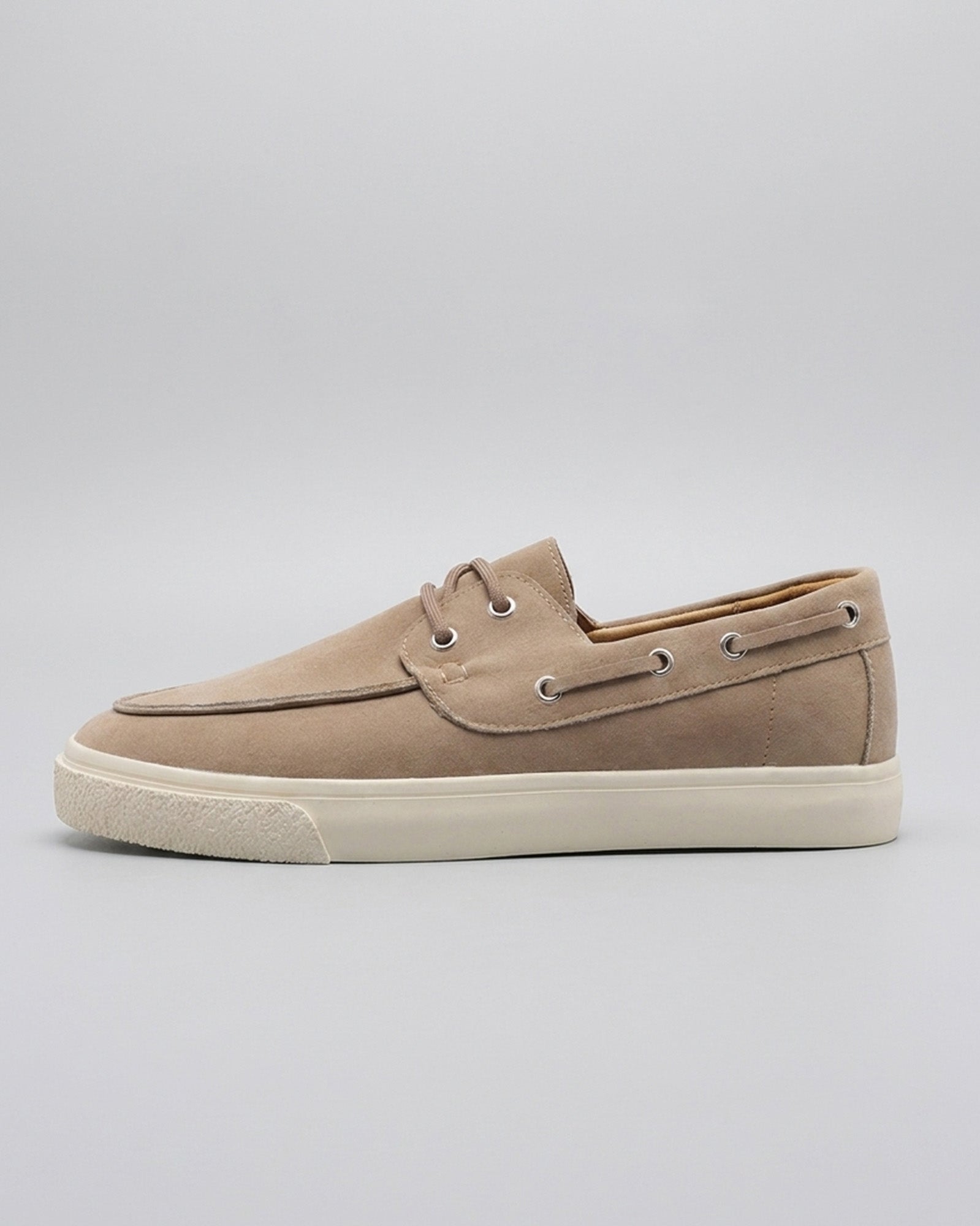 Side view of Harwich men's suede boat shoe sneaker in beige with cream cupsole