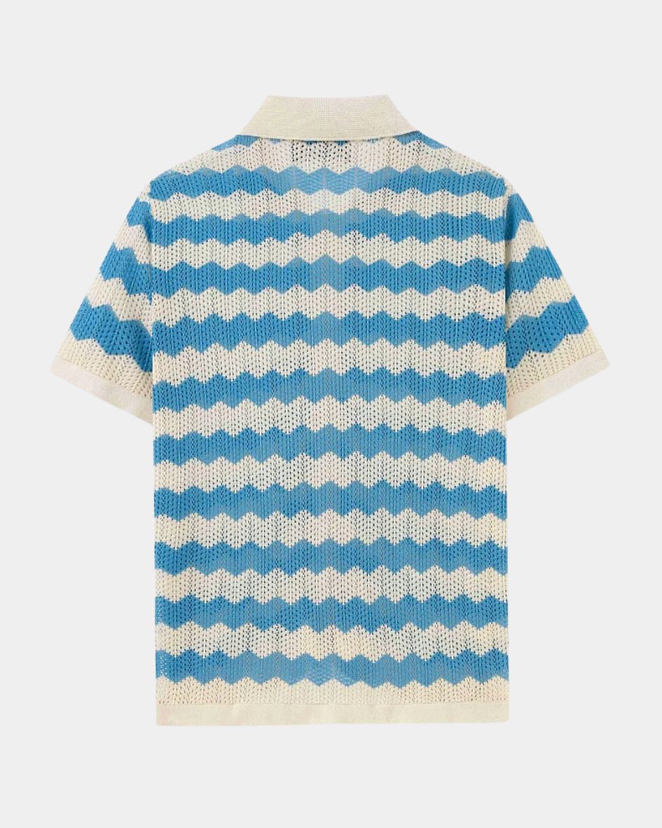 Blue and white striped knitted shirt on a light gray background