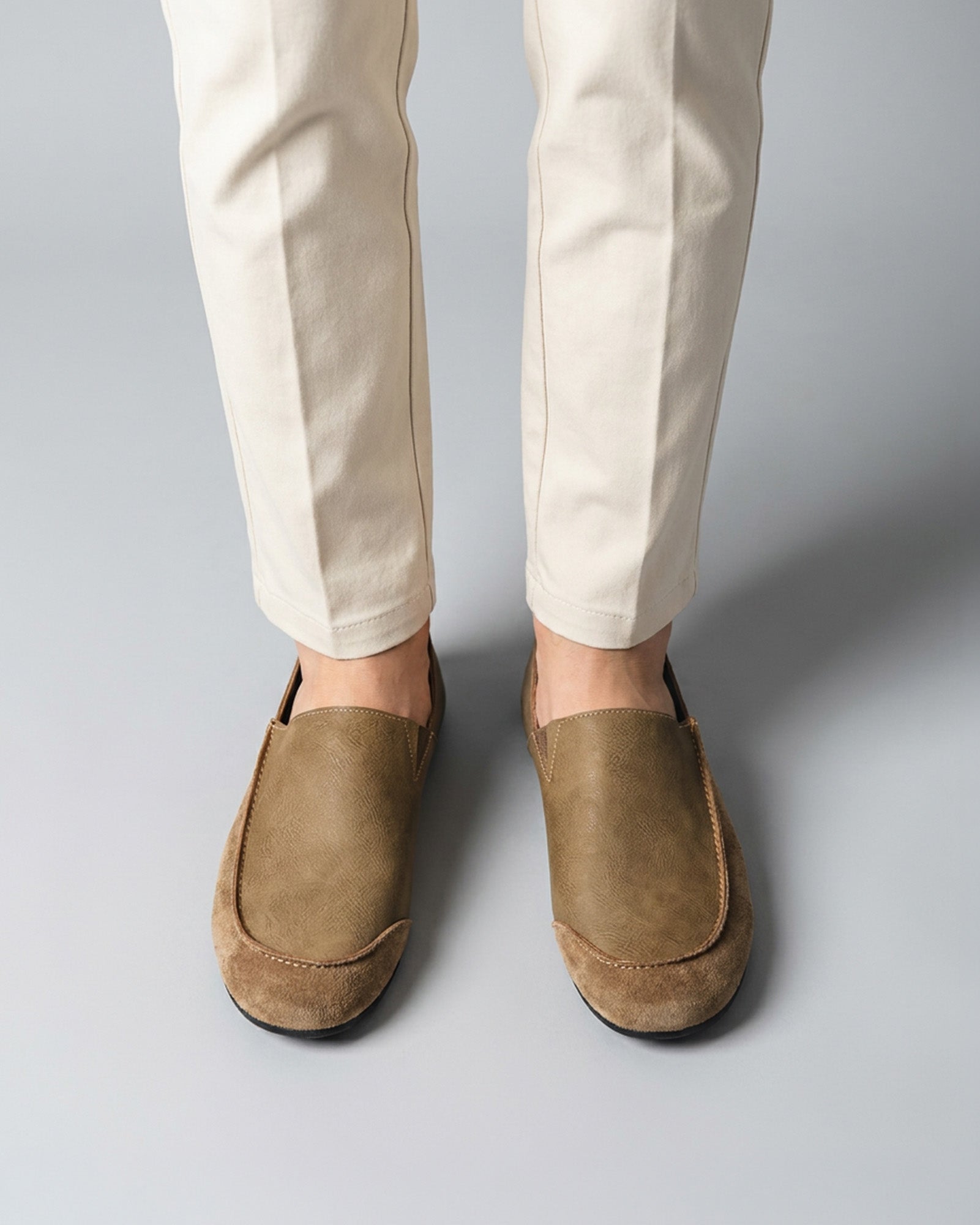 Front view of Luca men's beige relaxed slip-on loafers on foot