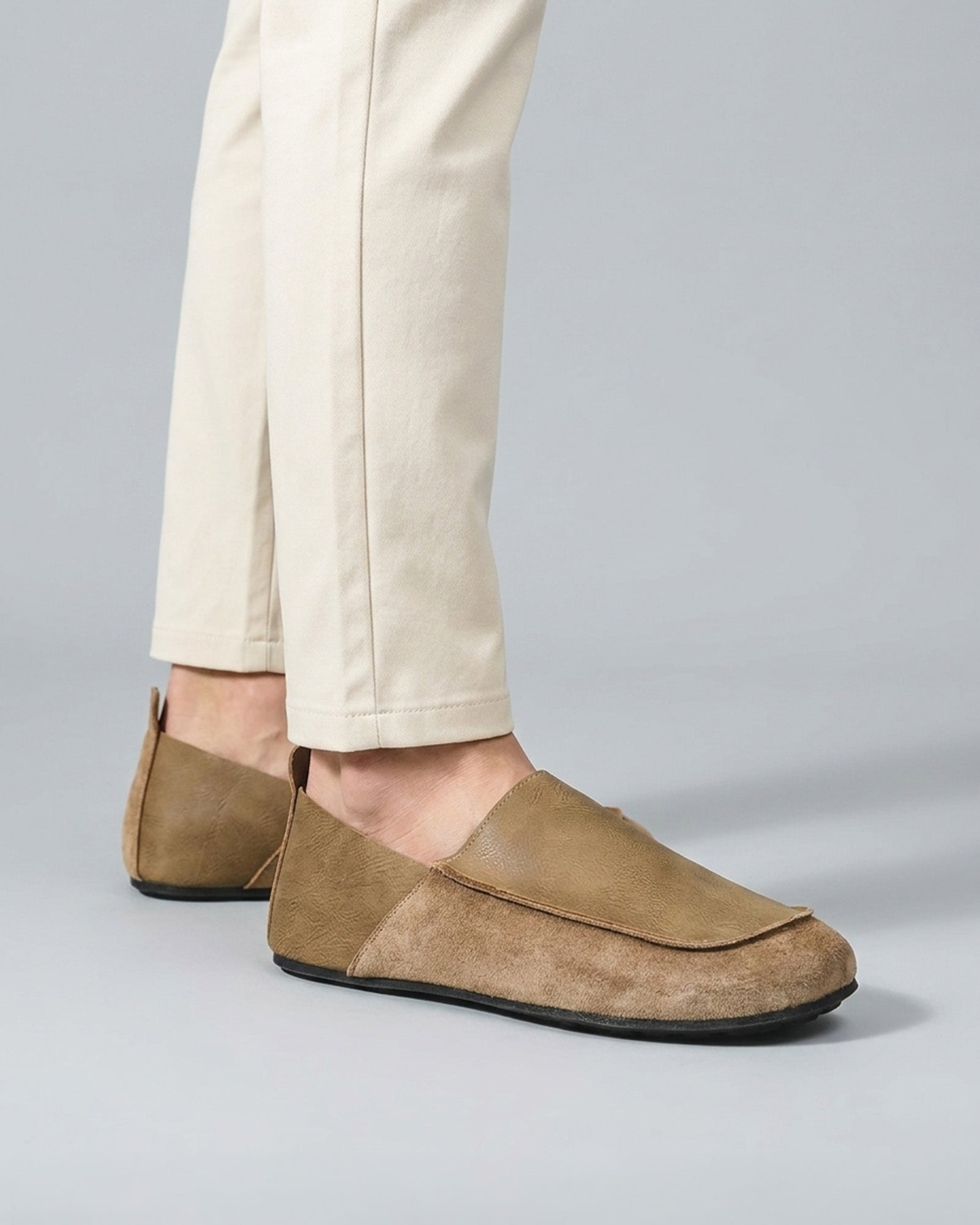 Luca men's beige relaxed slip-on loafers worn with cream trousers