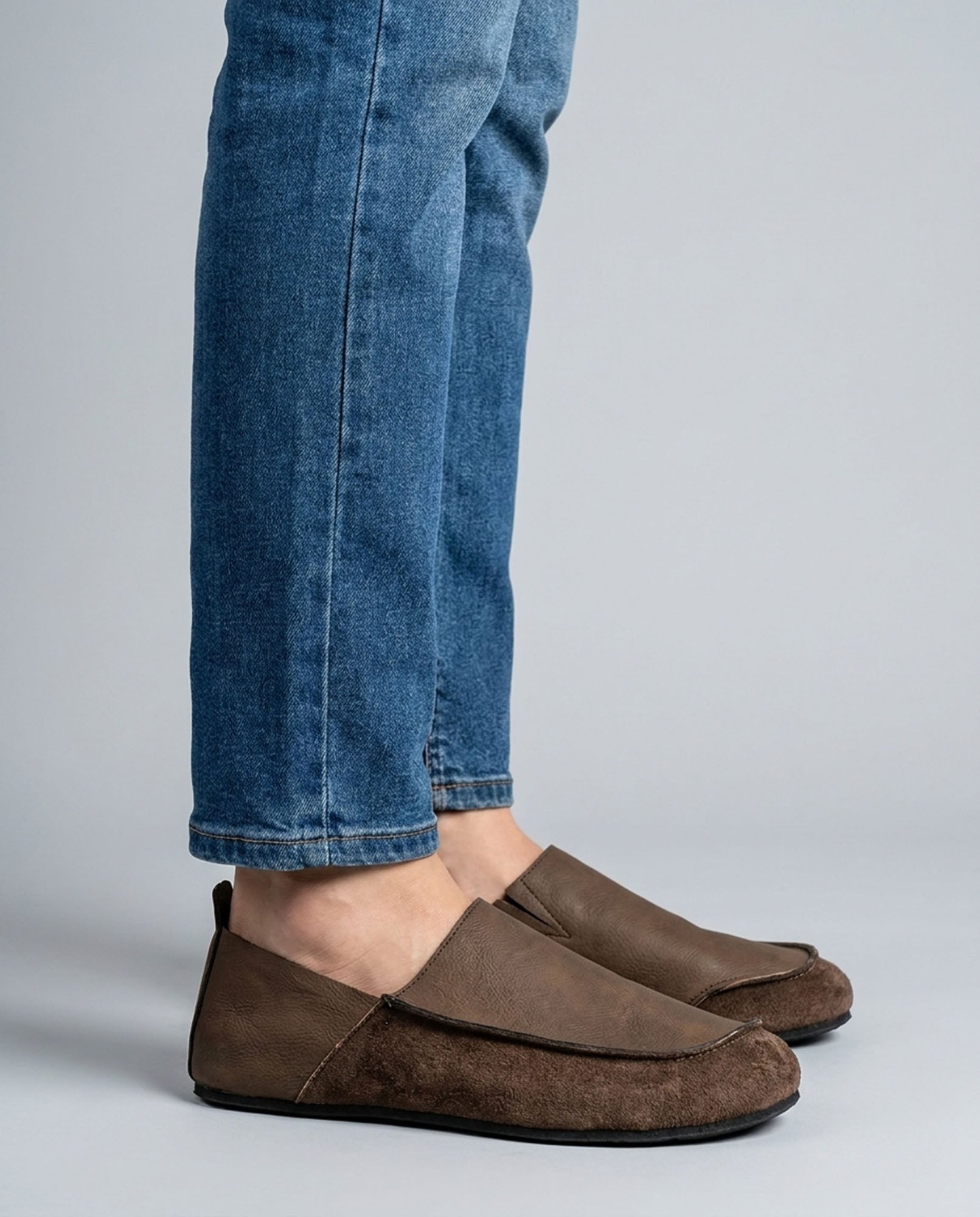 Luca men's brown relaxed slip-on loafers styled with blue denim jeans