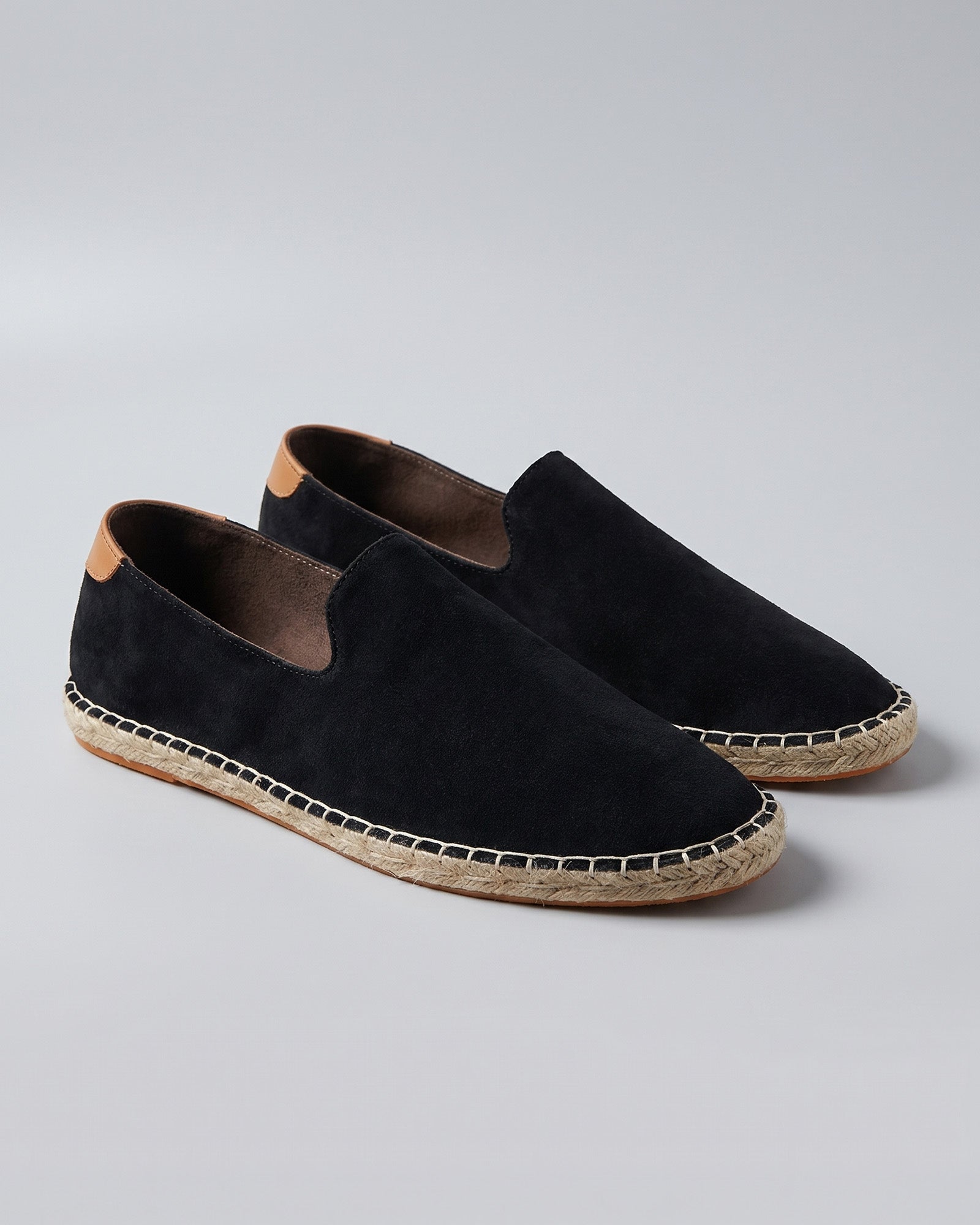 Pair of Malaga men's black suede espadrille loafers with tan heel counter and jute sole