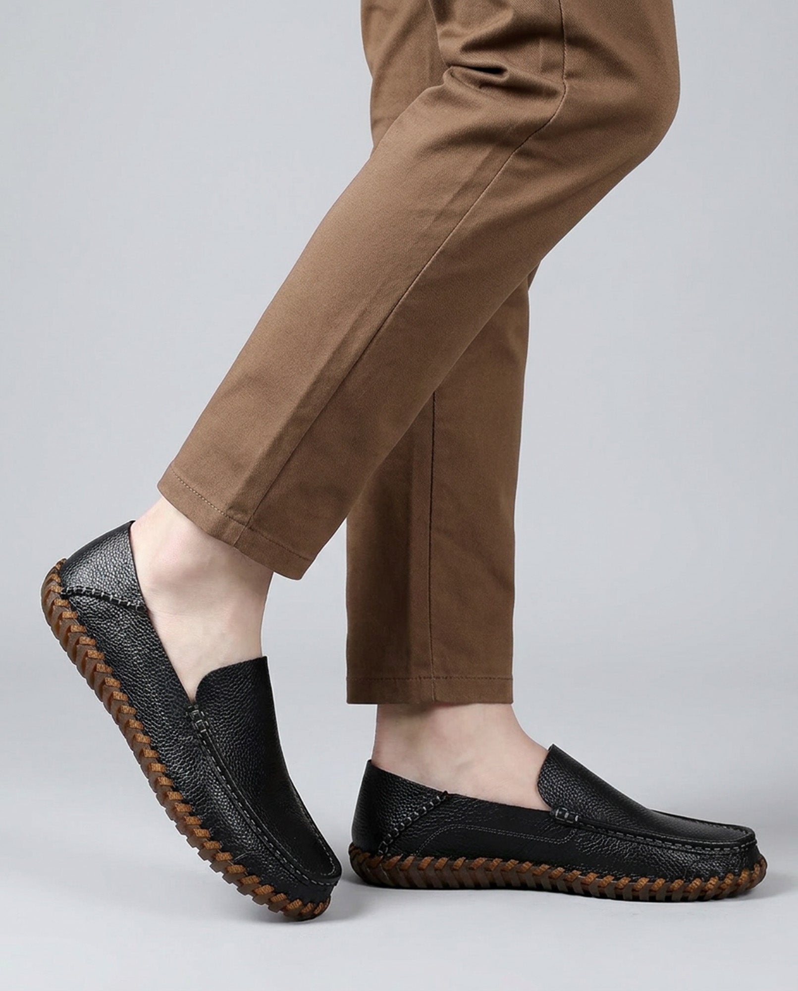 Marlow men's black leather driving loafers styled with tan chinos