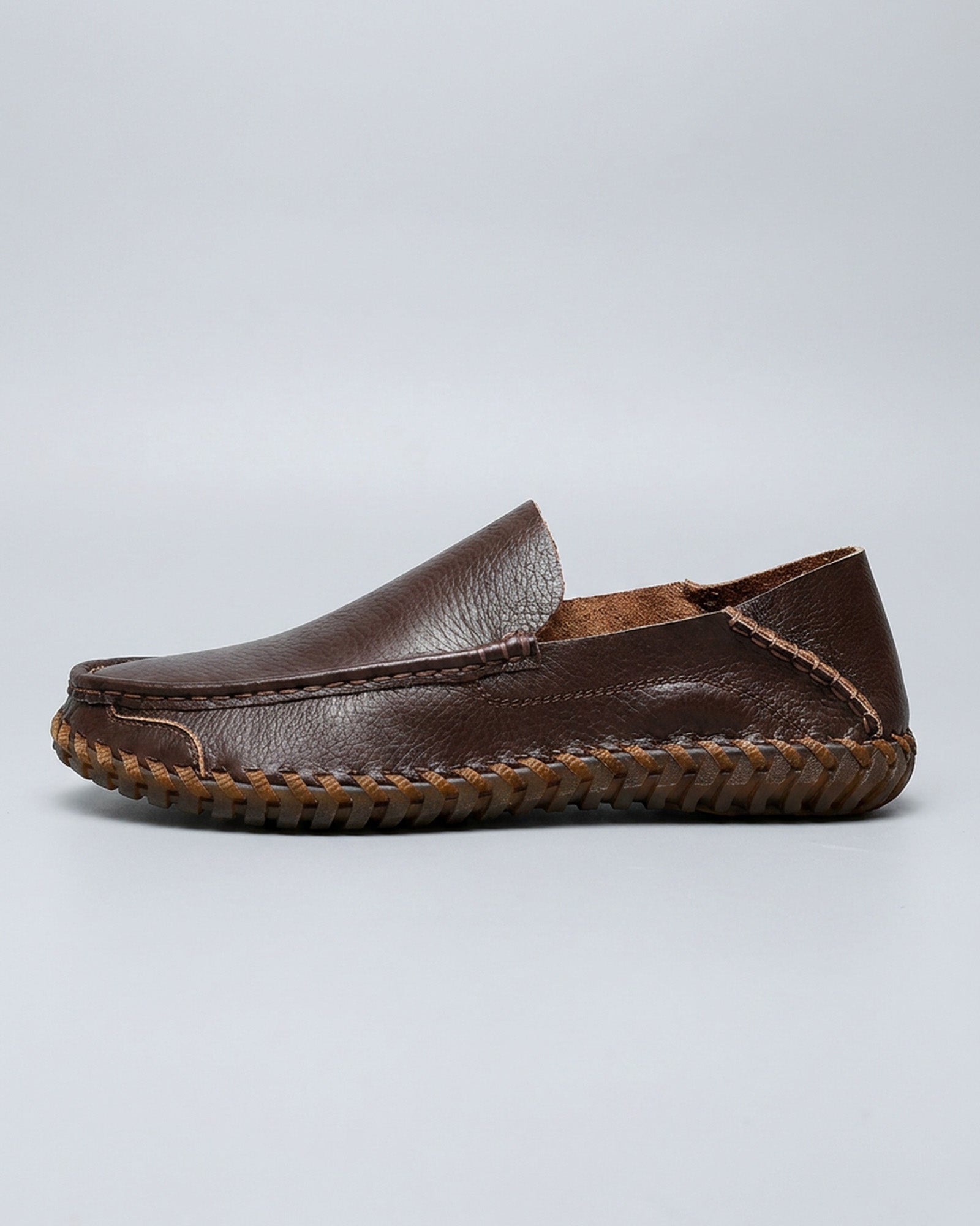 Side view of Marlow men's dark brown leather driving loafer with woven sole detailing