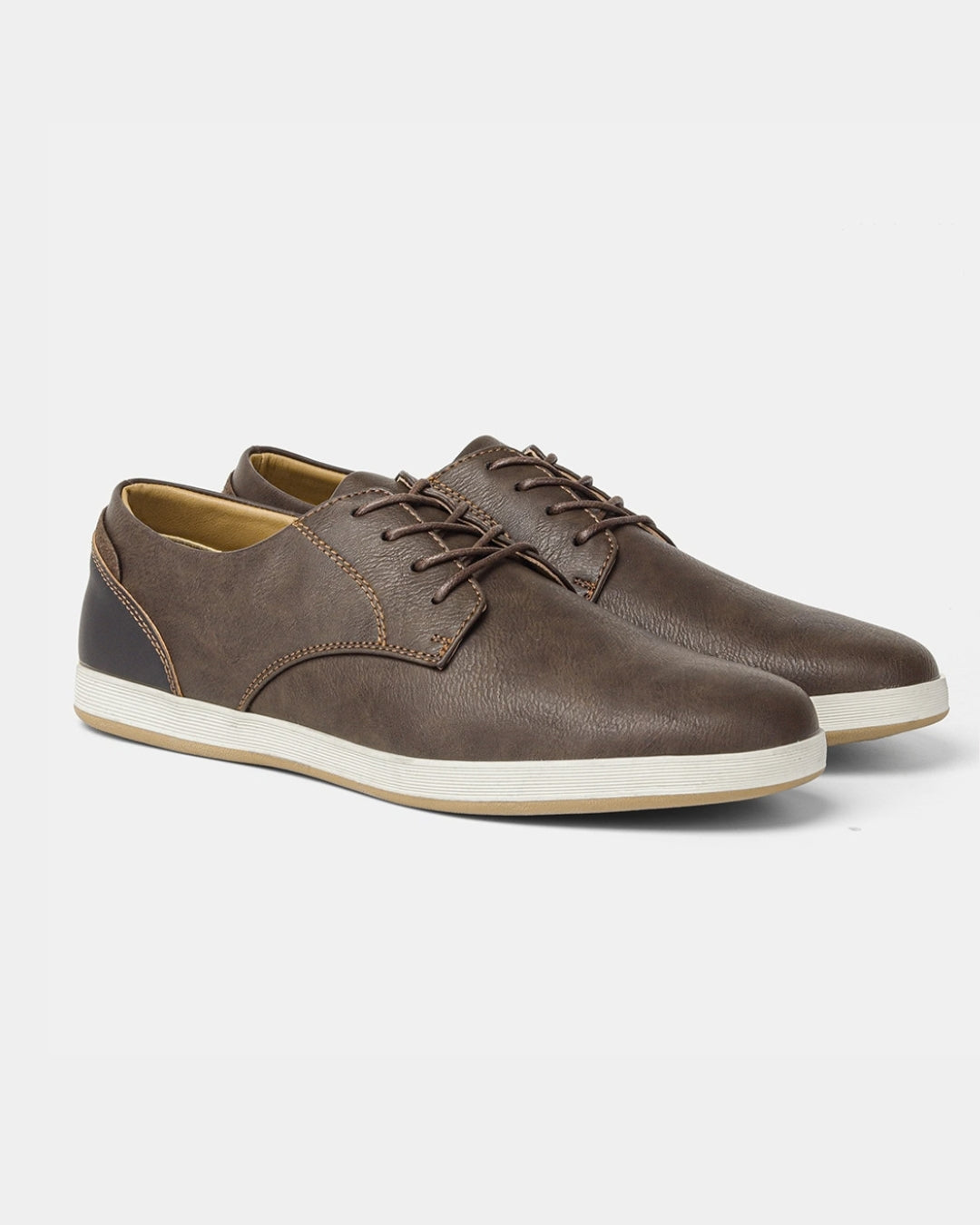 Brown synthetic leather men's lace-up dress sneakers with a white rubber sole and classic derby-inspired design.