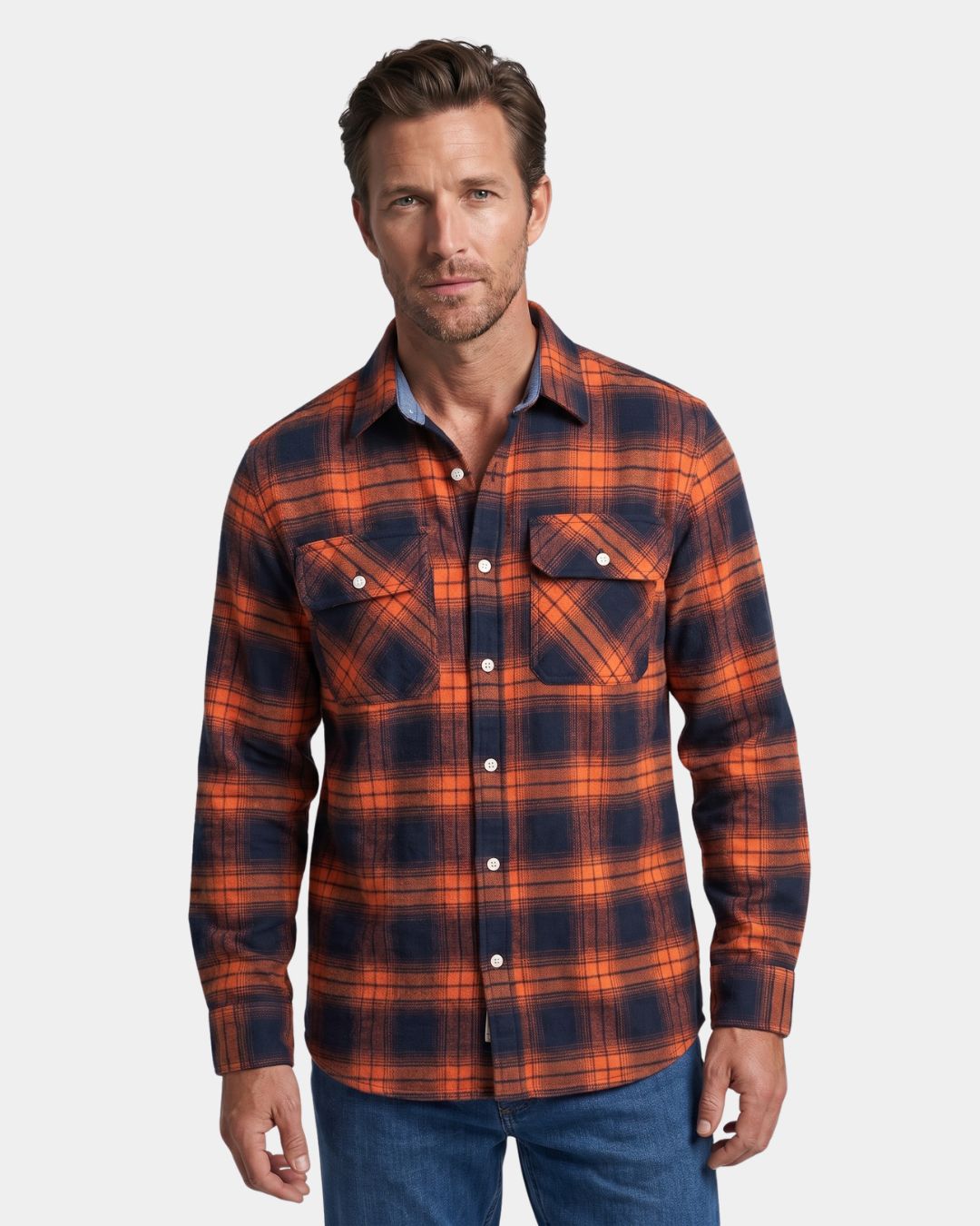 Men wearing a long-sleeve, orange and navy blue plaid flannel shirt with a button-front and two chest pockets.