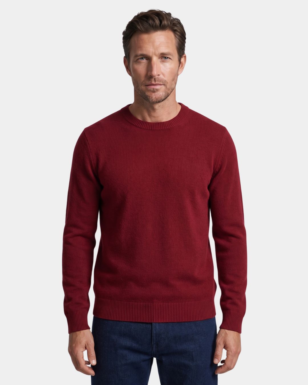 Men wearing a burgundy 100% wool crew neck sweater with ribbed cuffs, hem, and neckline against a white background.