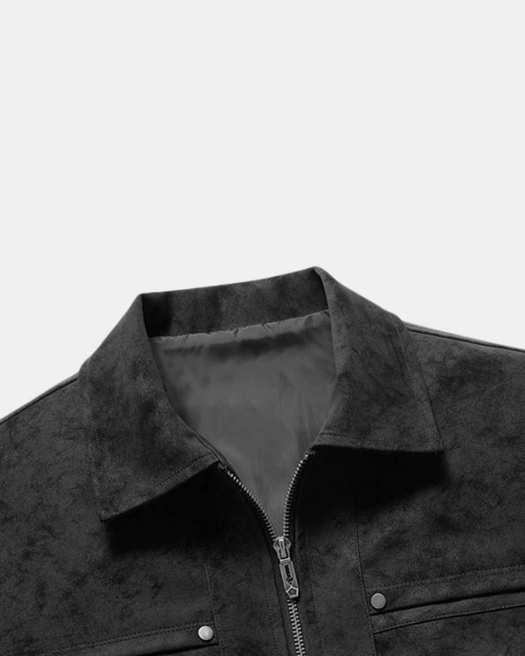 Close-up of a black bomber jacket collar with a silver zipper and metal snap buttons, set against a light gray background.