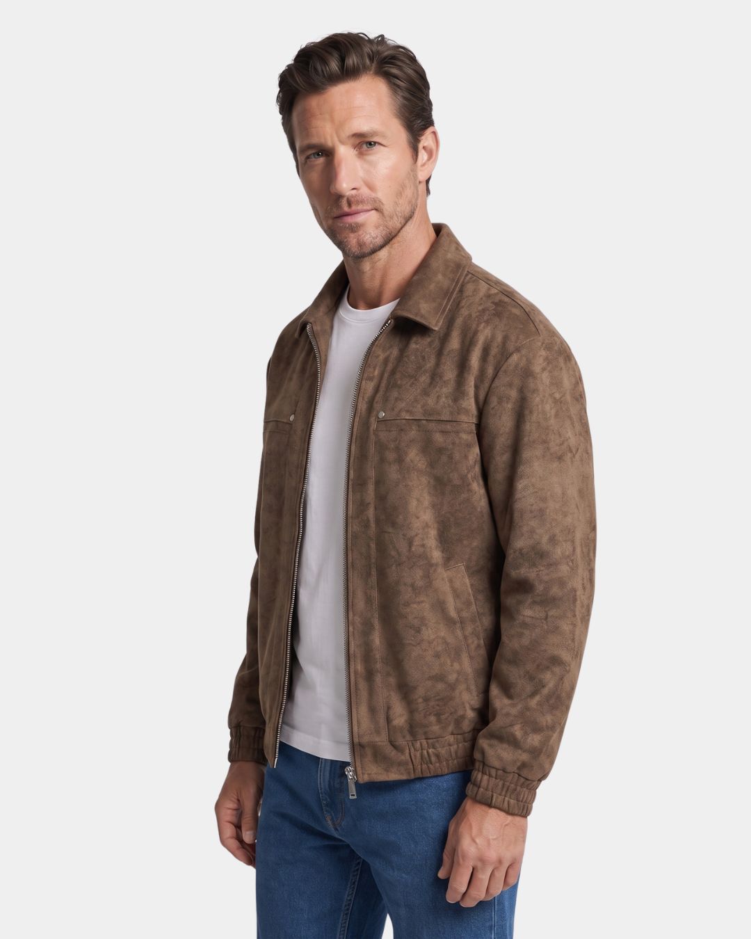 Three-quarter view of a man wearing a brown collared bomber jacket with blue jeans