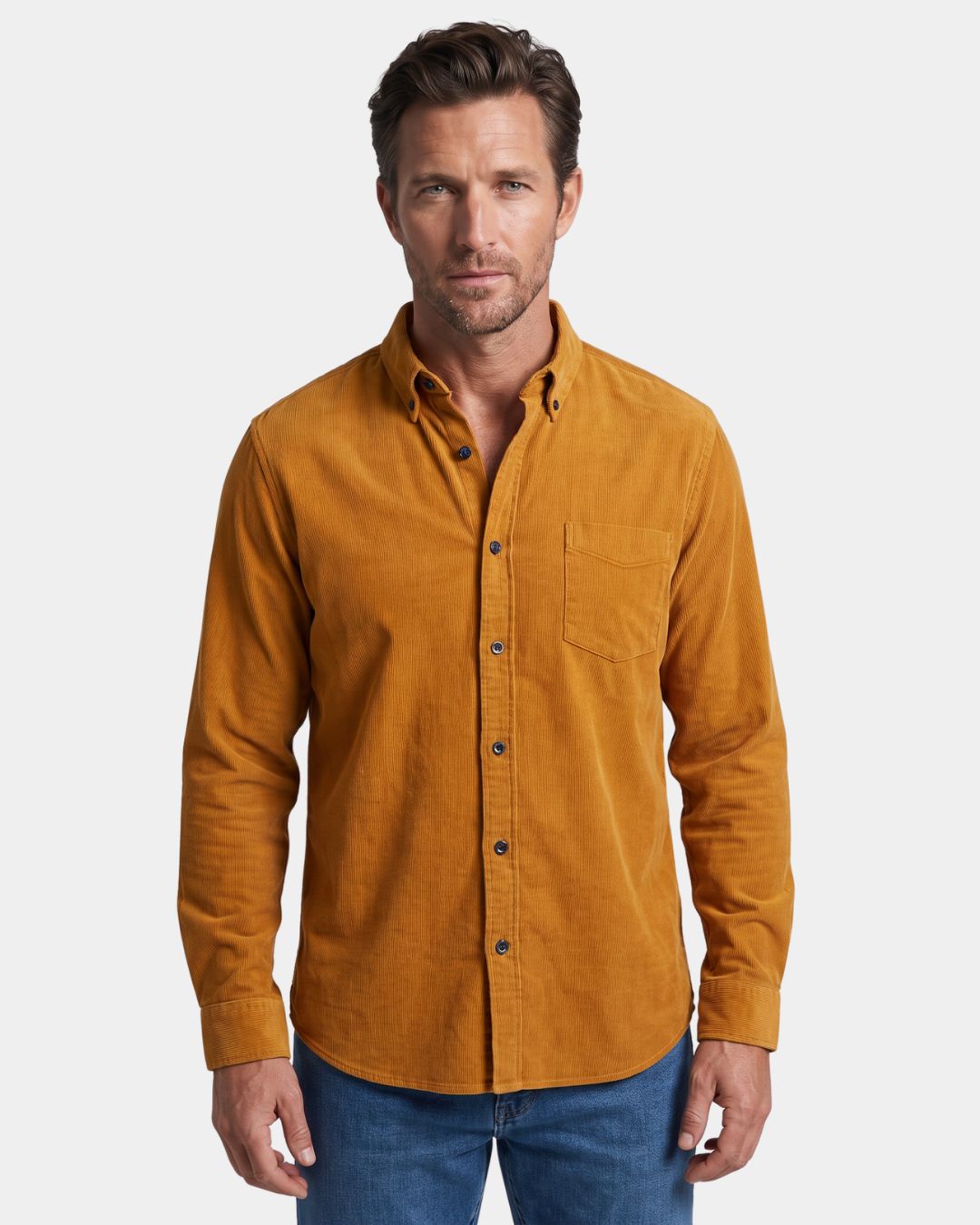 Man wearing a slim-fit mustard yellow cotton corduroy button-down shirt with a chest pocket and ribbed texture.