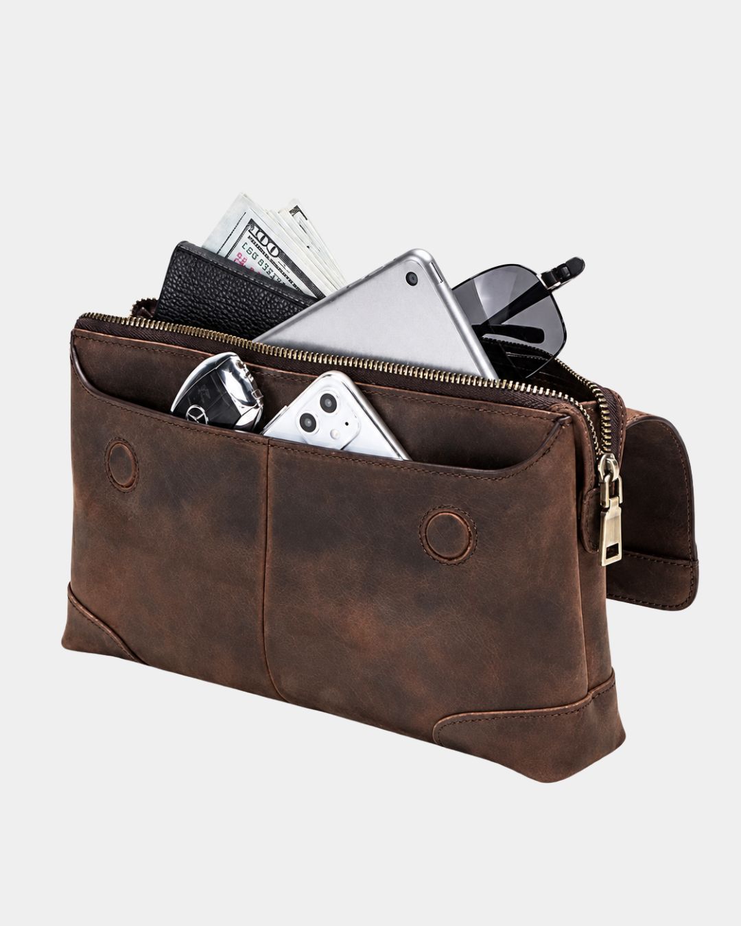 Distressed brown Crazy Horse leather men's clutch bag filled with a tablet, smartphone, cash, and sunglasses.