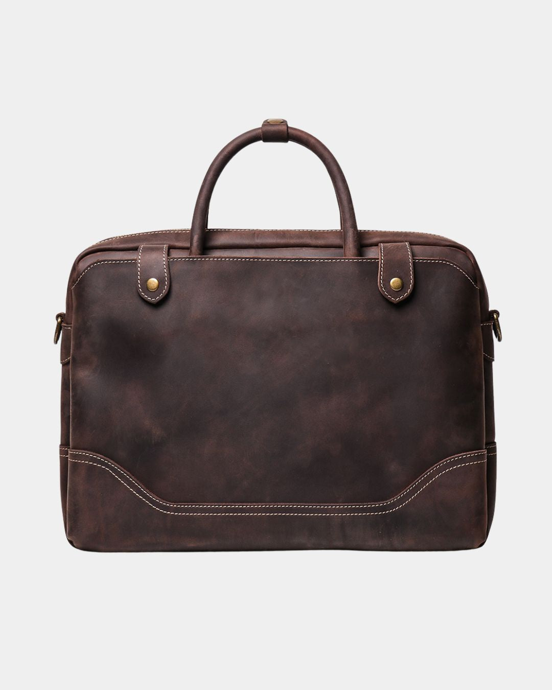 A dark brown distressed leather briefcase with dual top handles and brass hardware, shown against a light gray background.