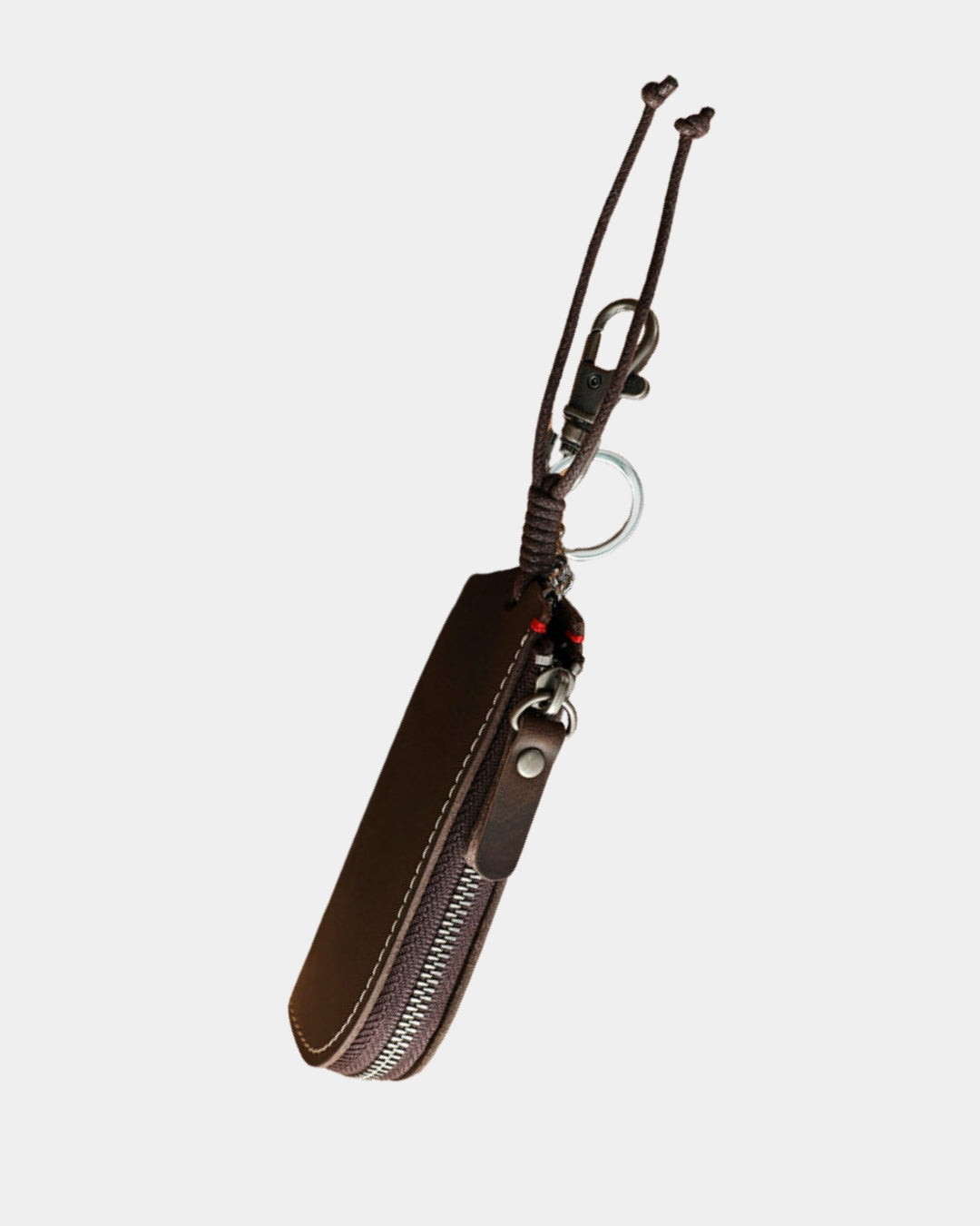 Compact brown genuine cowhide leather key wallet with a zippered closure, metal key ring, and clip for belt loops.