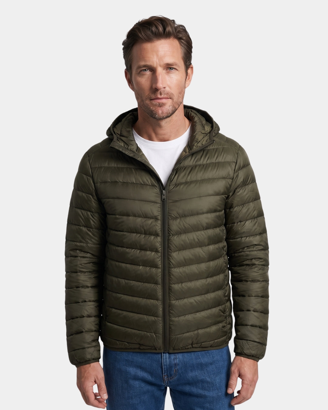 Man wearing an olive green, lightweight hooded puffer jacket with a quilted design and full-zip front.