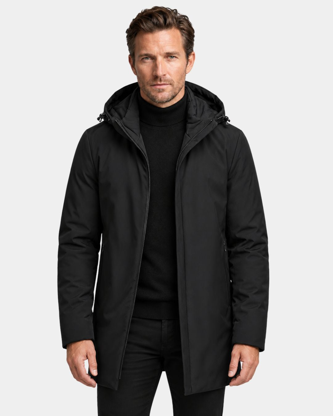 Man wearing a black mid-length hooded winter parka with a full-zip front and padded insulation.