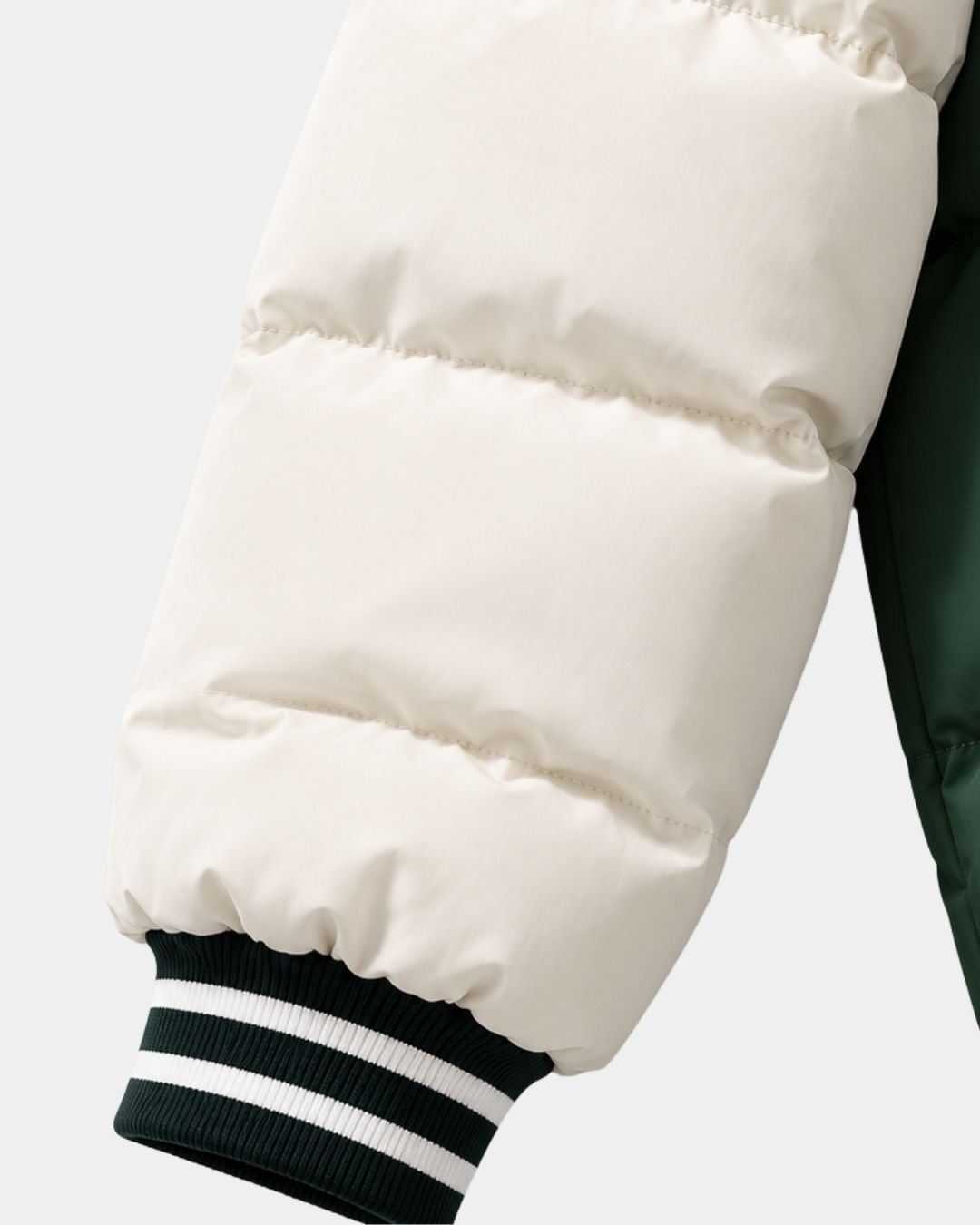 Cream and dark green puffer jacket sleeve with striped ribbed cuffs.