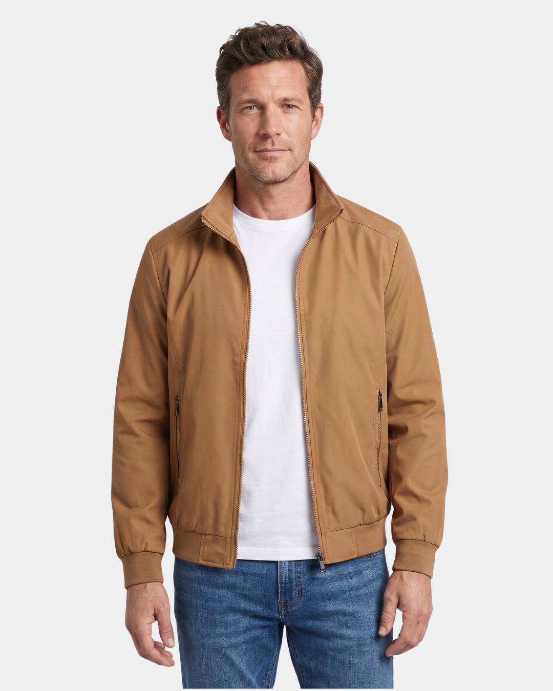 Man wearing a tan lightweight Harrington jacket with a stand collar, zip front, and ribbed cuffs over a white T-shirt.