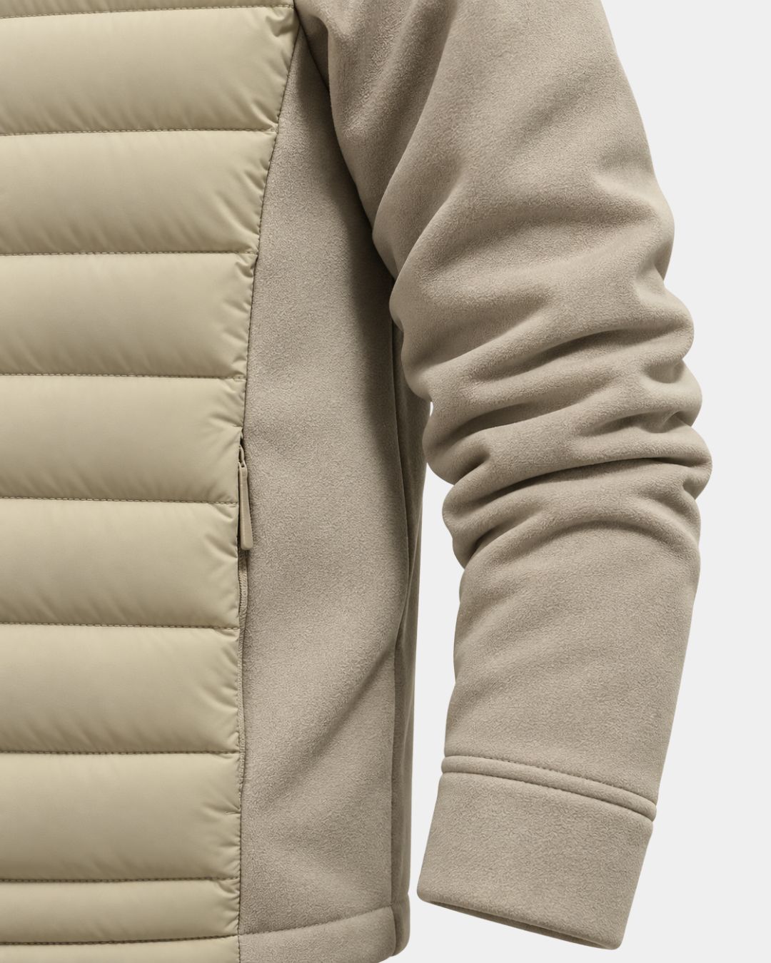 Beige hybrid puffer jacket with quilted front panels, smooth fleece sleeves, and a zippered side pocket.
