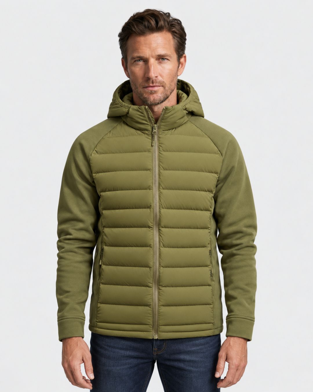 Olive green men’s hybrid puffer jacket with a quilted body, attached hood, full-zip front, and smooth long sleeves.