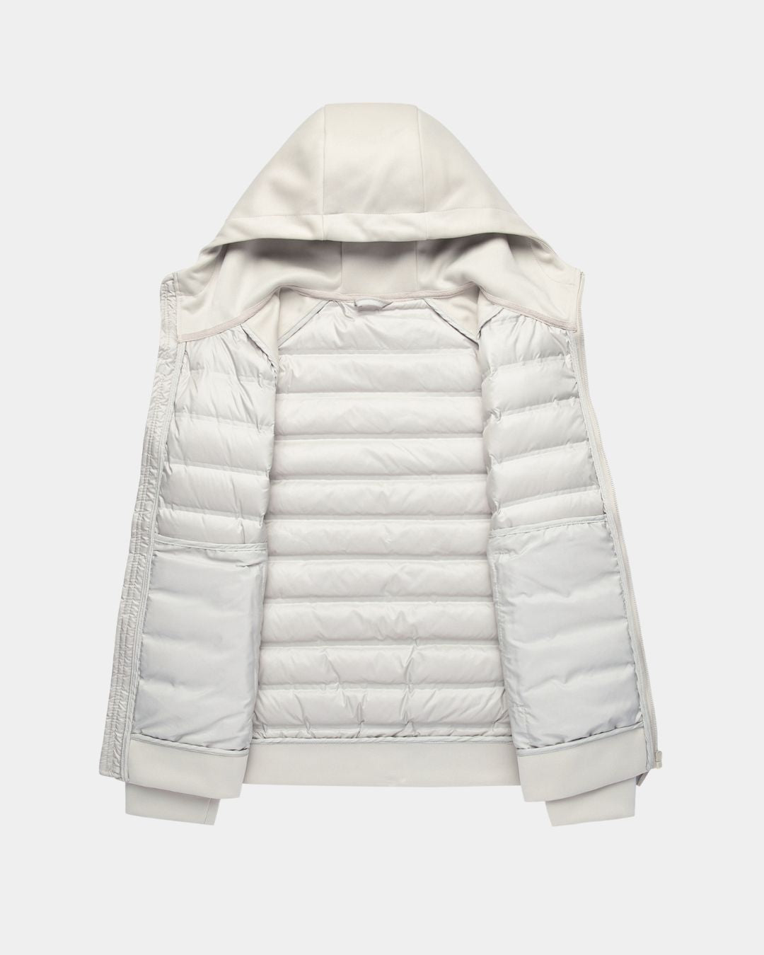 Light grey men’s hybrid puffer jacket with a quilted down body, knit sleeves, and an attached hood.