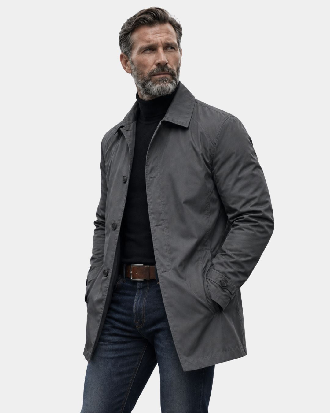 Man wearing a charcoal grey lightweight short trench coat with button-front closure and a tailored car-coat silhouette.