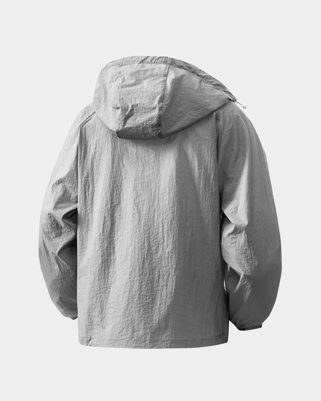 Back view of a grey lightweight, waterproof hooded windbreaker jacket made from crinkled nylon fabric.