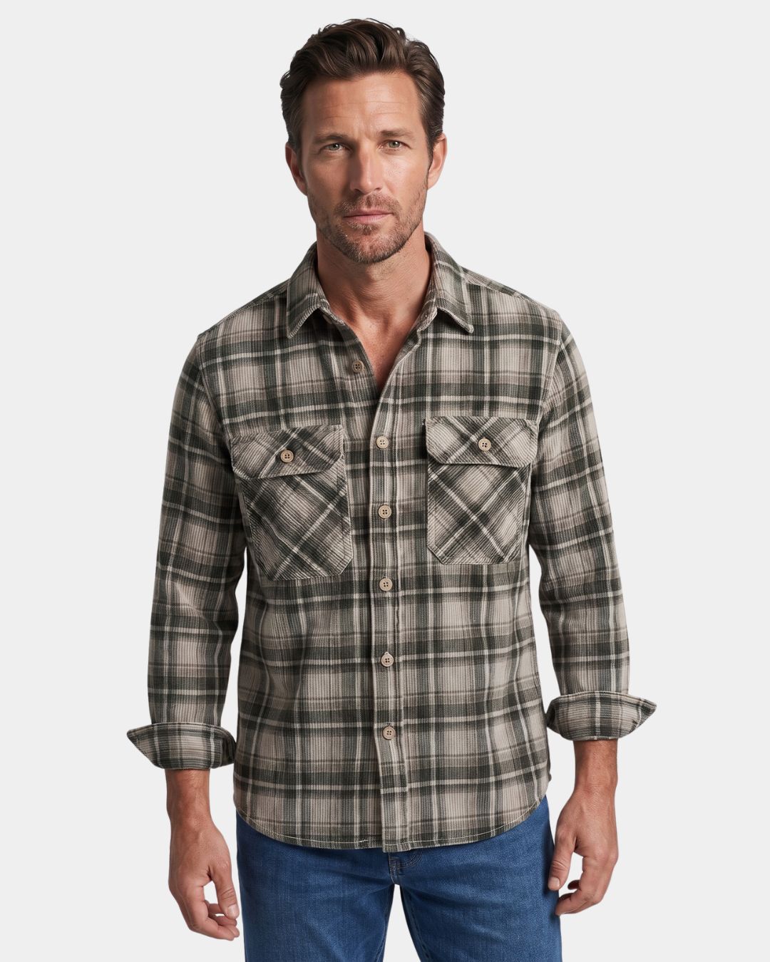 Man wearing a grey and olive plaid corduroy long-sleeve shirt with a button-front, spread collar, and two chest pockets.