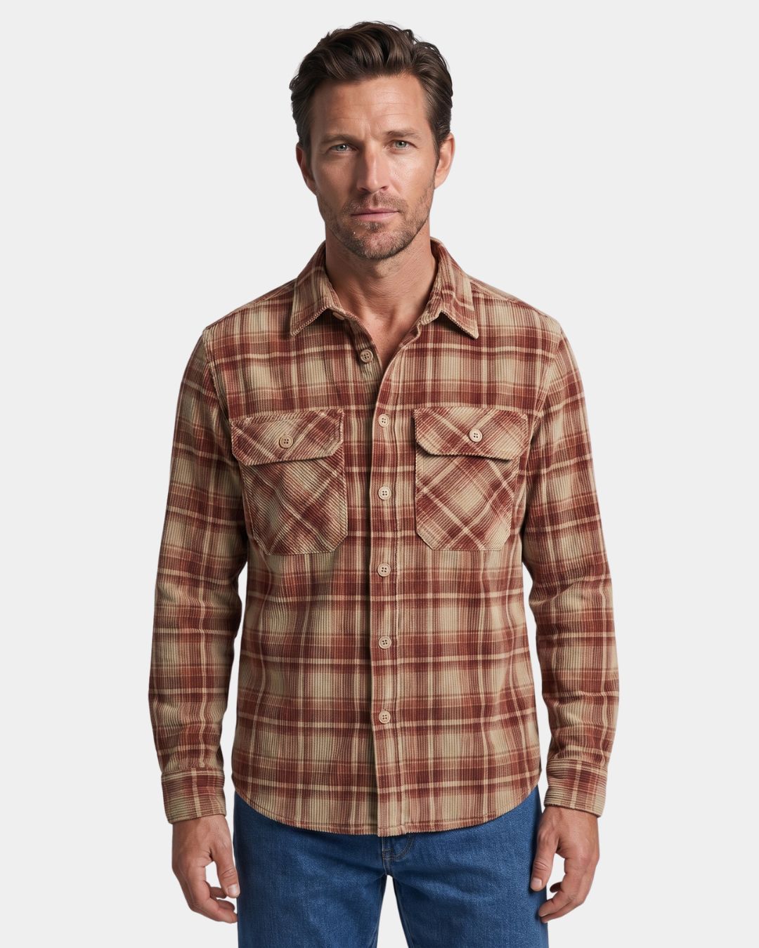 Man wearing a red and tan plaid corduroy long-sleeve shirt with a spread collar and two buttoned chest pockets.