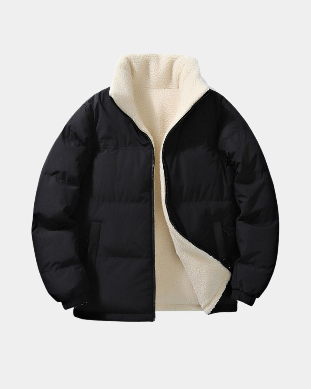 Men’s black reversible puffer jacket with a cream fleece lining, stand collar, and full-zip front.