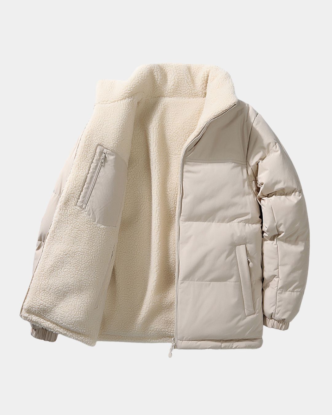Beige reversible puffer jacket with a smooth padded shell and soft cream fleece lining, featuring a full-zip stand collar.