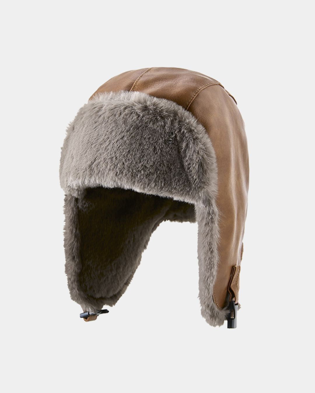Reversible brown faux leather trapper hat with grey fleece lining, ear flaps, and adjustable chin strap for winter.