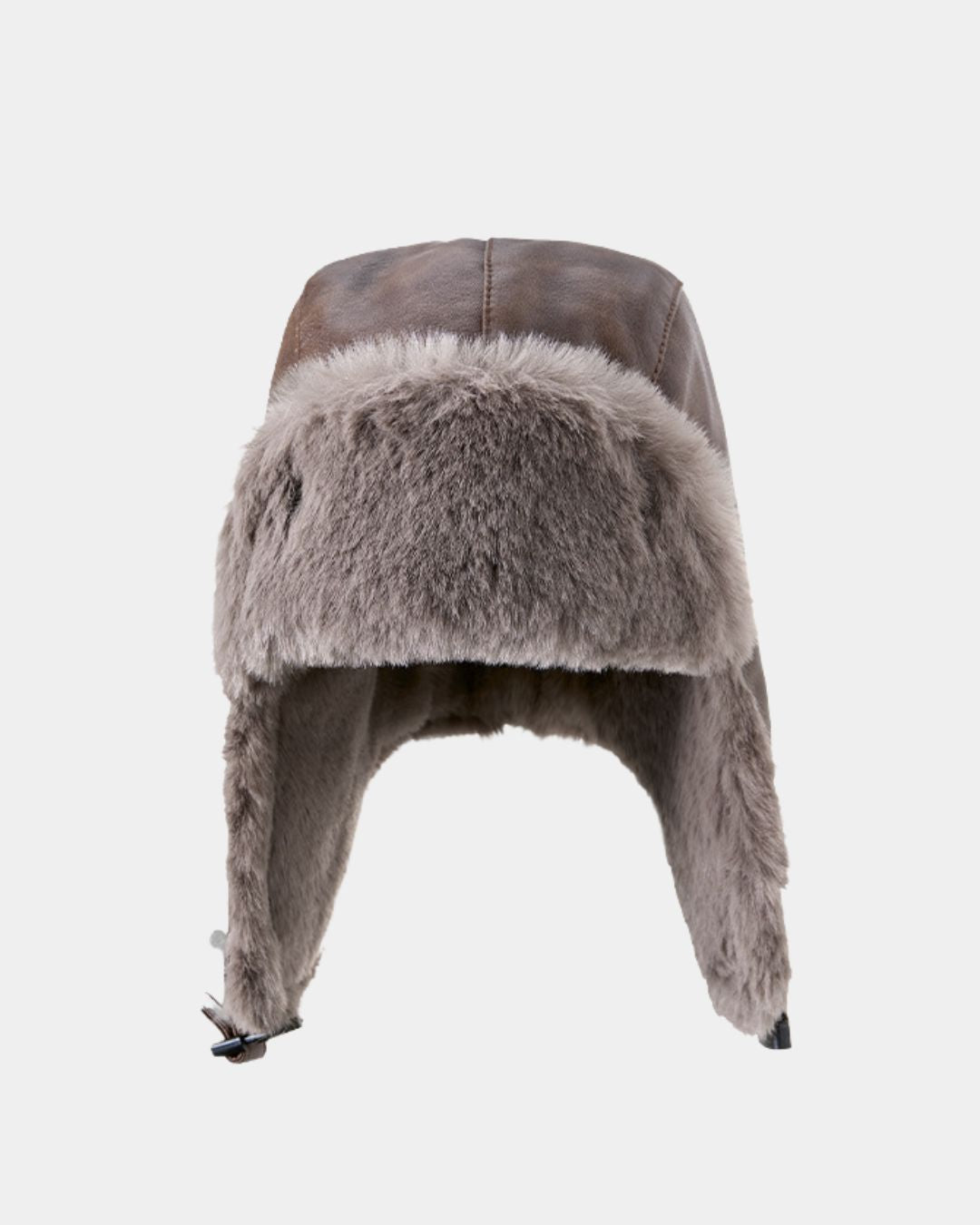 Brown reversible men's trapper hat with a waterproof outer shell and soft grey faux-fur lining and ear flaps.