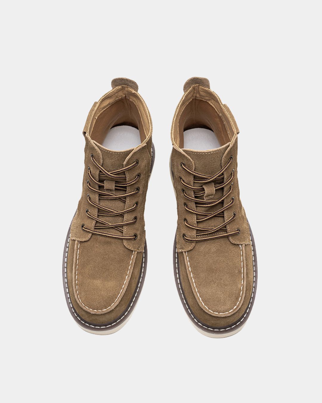 Tan suede men's moc toe ankle boots with lace-up closure, canvas panels, and a chunky rubber outsole.