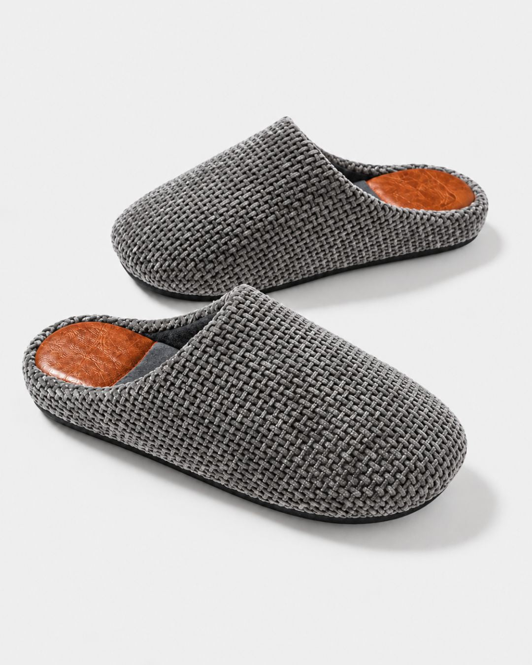 Men’s grey woven suede slip-on house slippers with a plush lining and a durable, textured non-slip TPR sole.