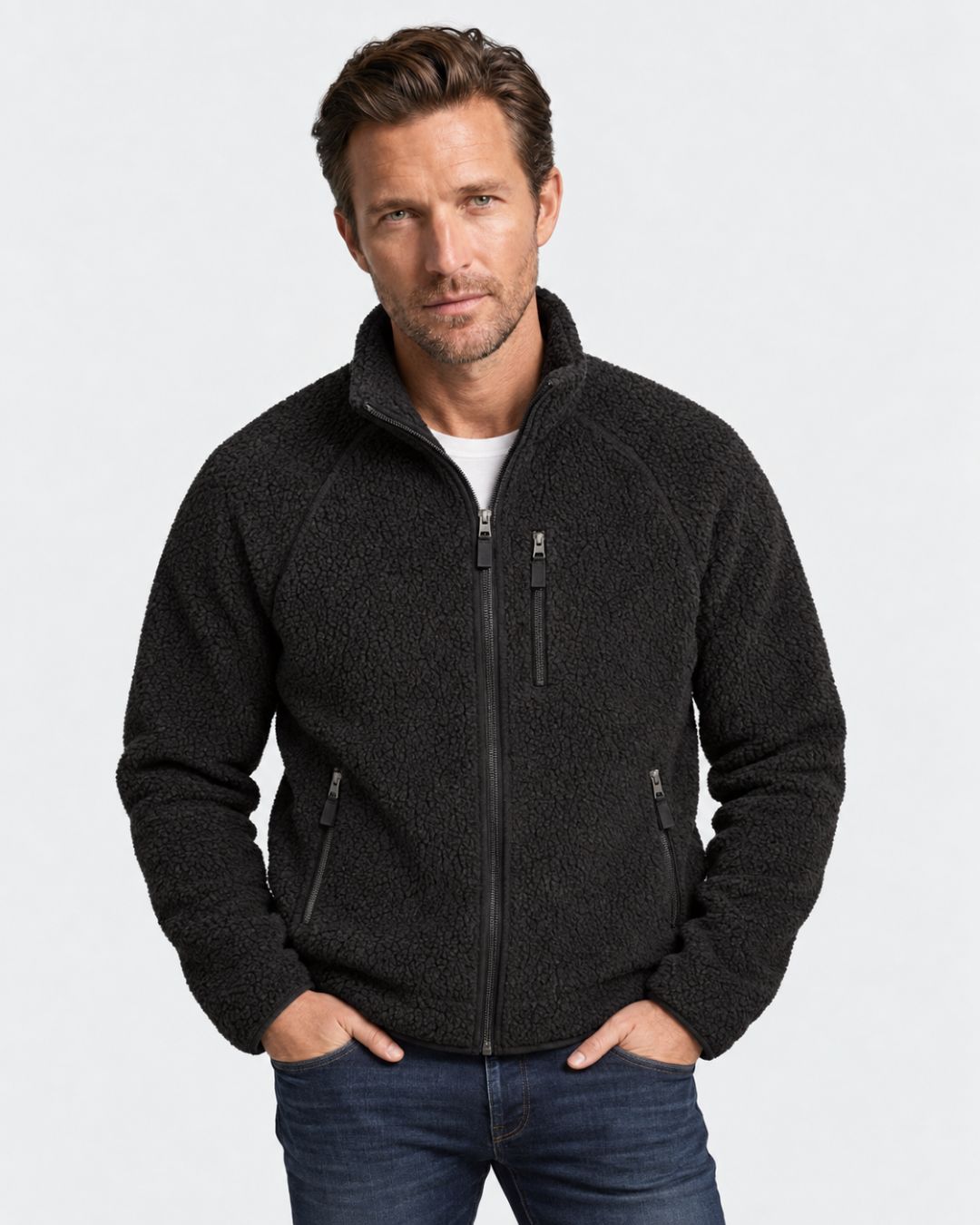Men’s black teddy sherpa fleece jacket with a stand collar, full-zip front, and zippered chest and side pockets.