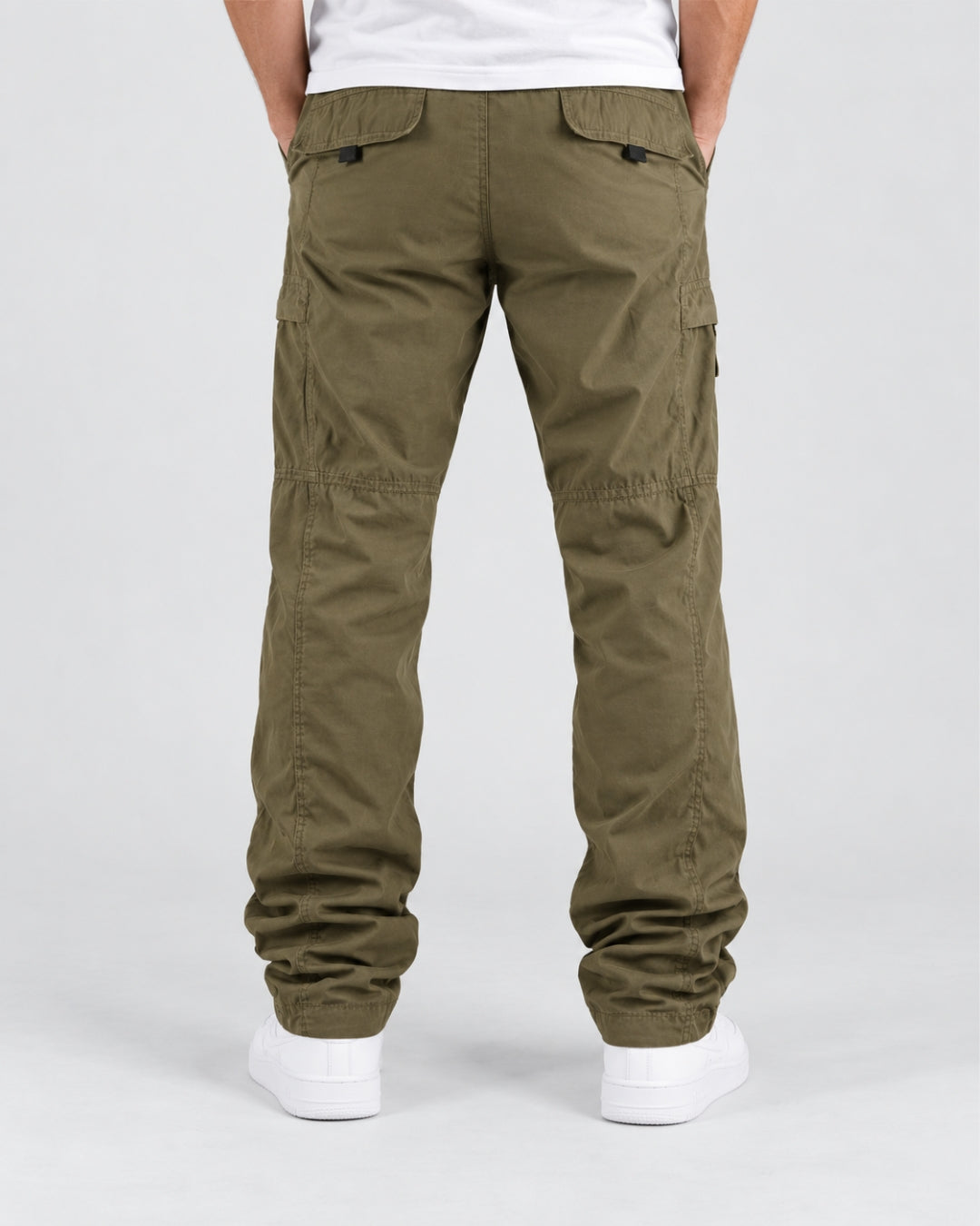 Olive green fleece-lined cargo pants with a relaxed fit, back flap pockets, and knee seam detailing on a man.
