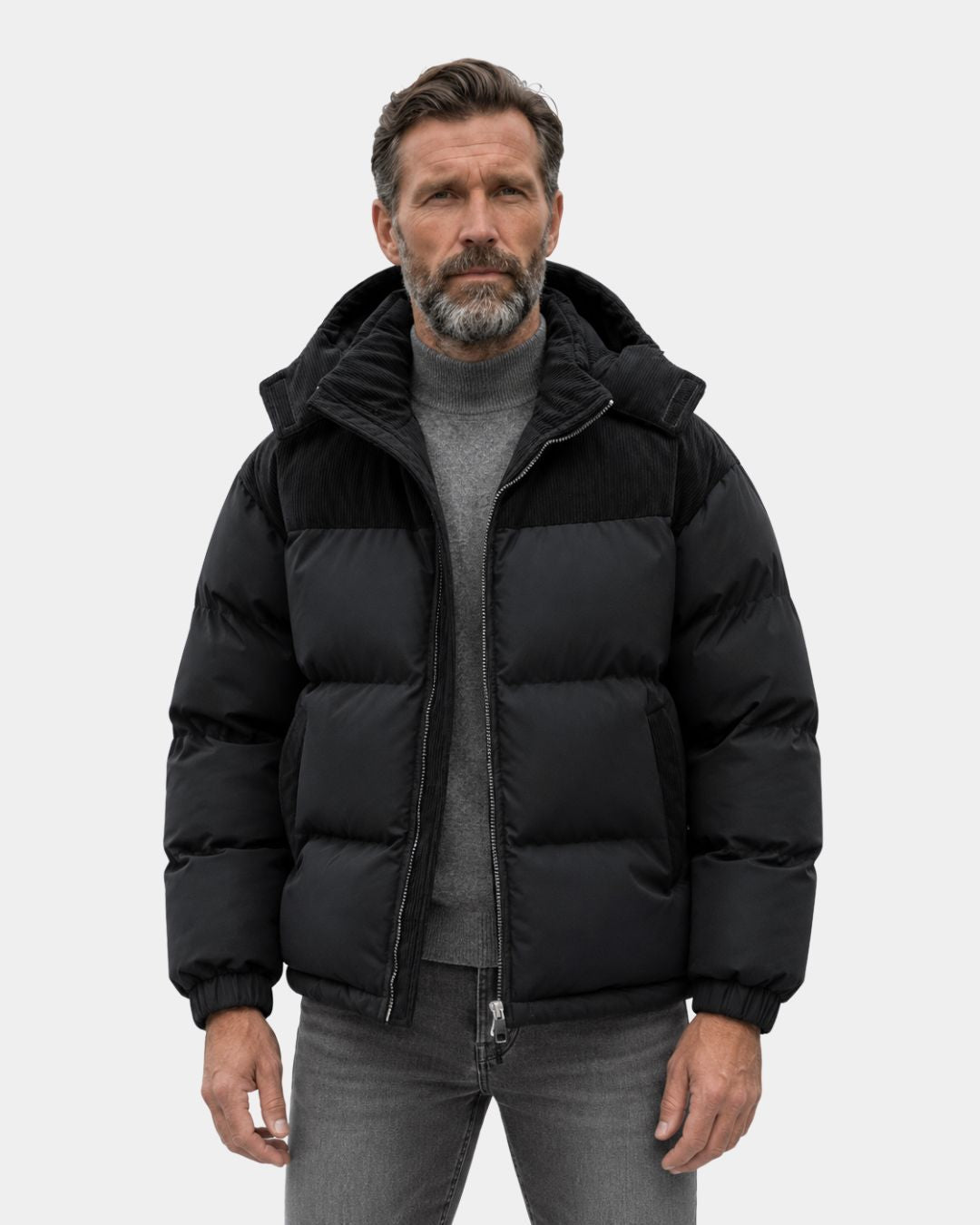 Black men’s winter puffer jacket with detachable hood and corduroy shoulder and pocket detailing.