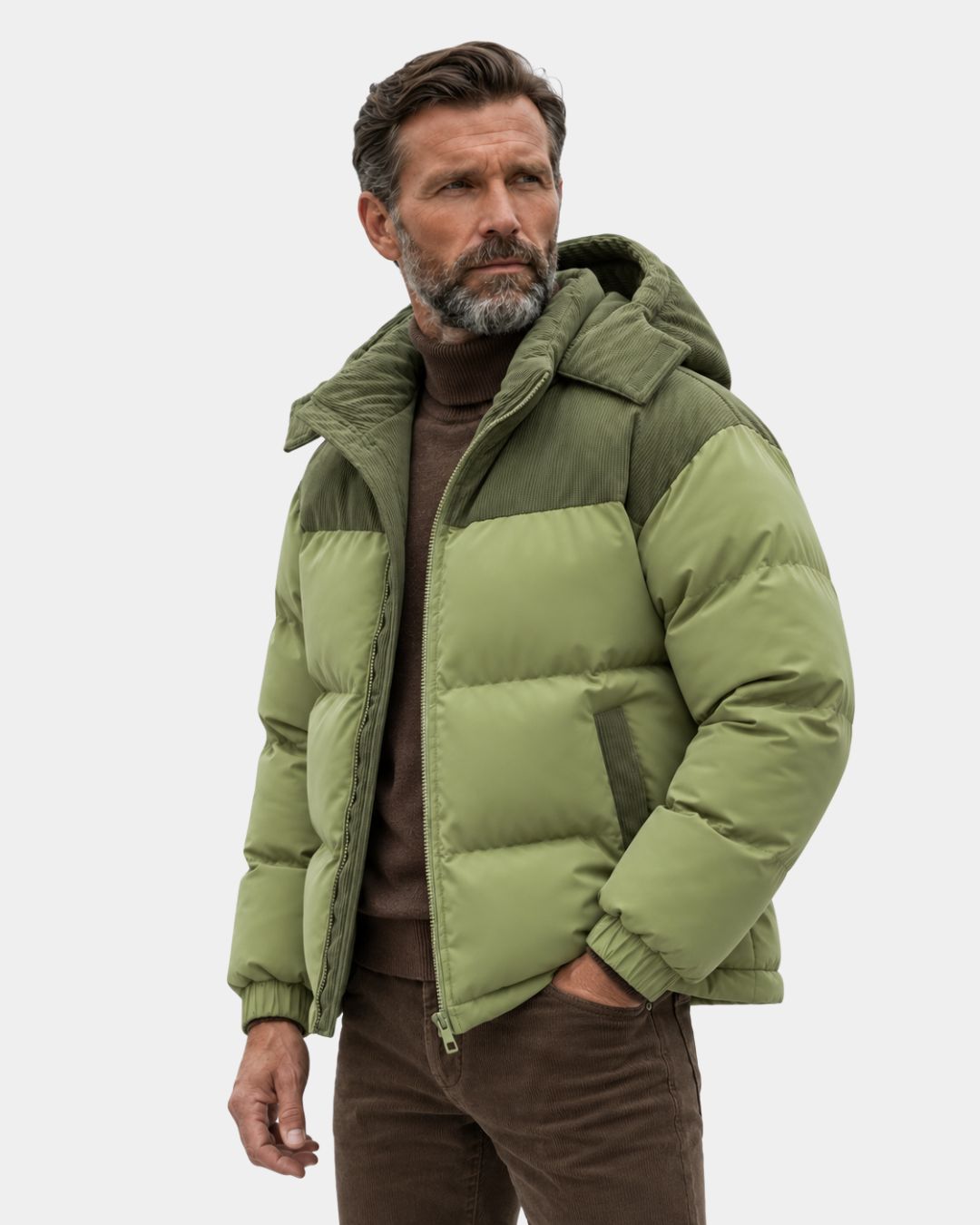 Men’s olive green puffer jacket with a detachable hood and contrasting corduroy shoulder and pocket detailing.
